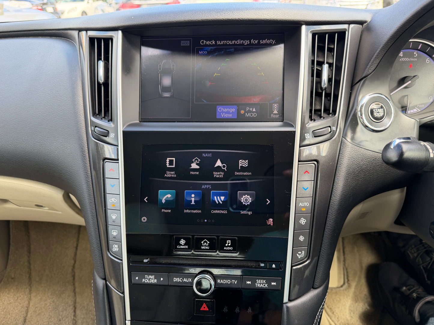 Interior dashboard of 2015 Nissan Skyline V6 3.5L Hybrid with touchscreen display and controls.
