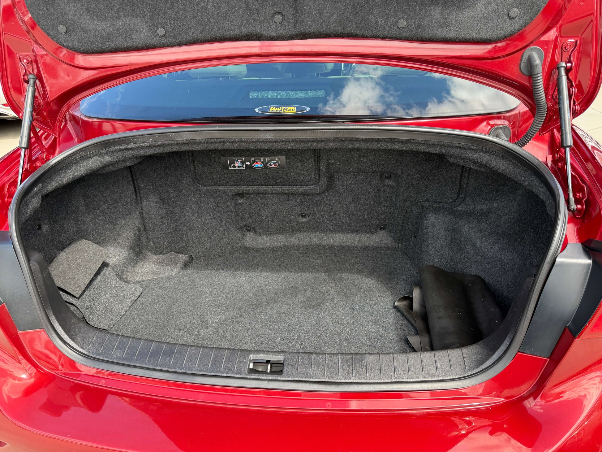 2015 Nissan Skyline V6 3.5L Hybrid trunk space showing ample storage area and clean interior finish.