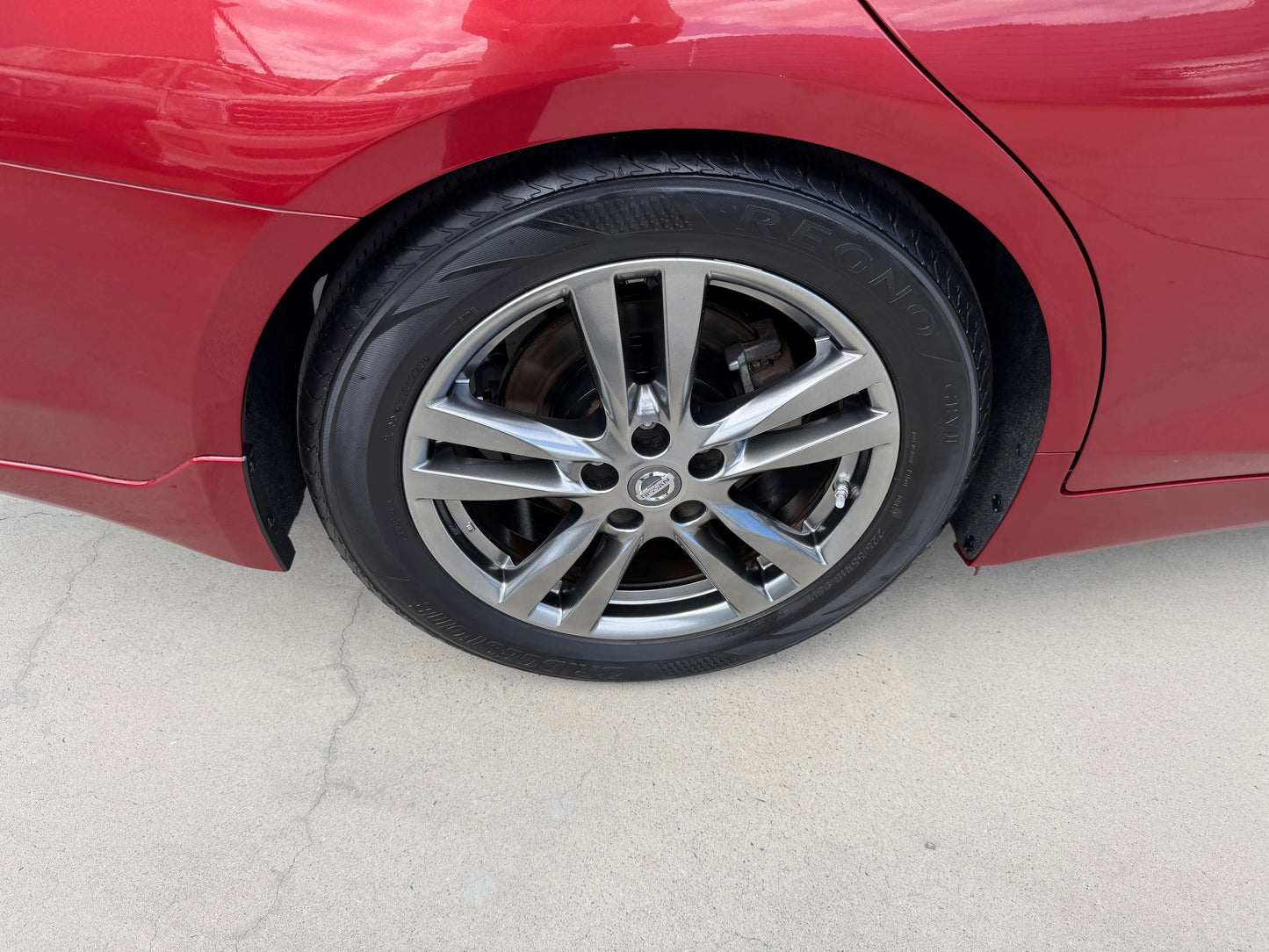 2015 Nissan Skyline V6 3.5L Hybrid sport sedan rear wheel with stylish alloy rim and tire detail