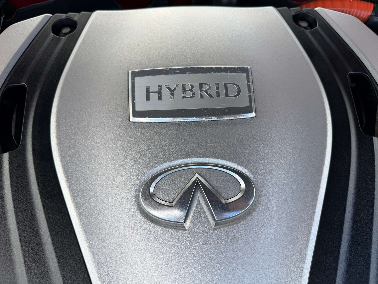 Infiniti hybrid engine cover highlighting HYBRID label for the 2015 Nissan Skyline V6 3.5L Hybrid.