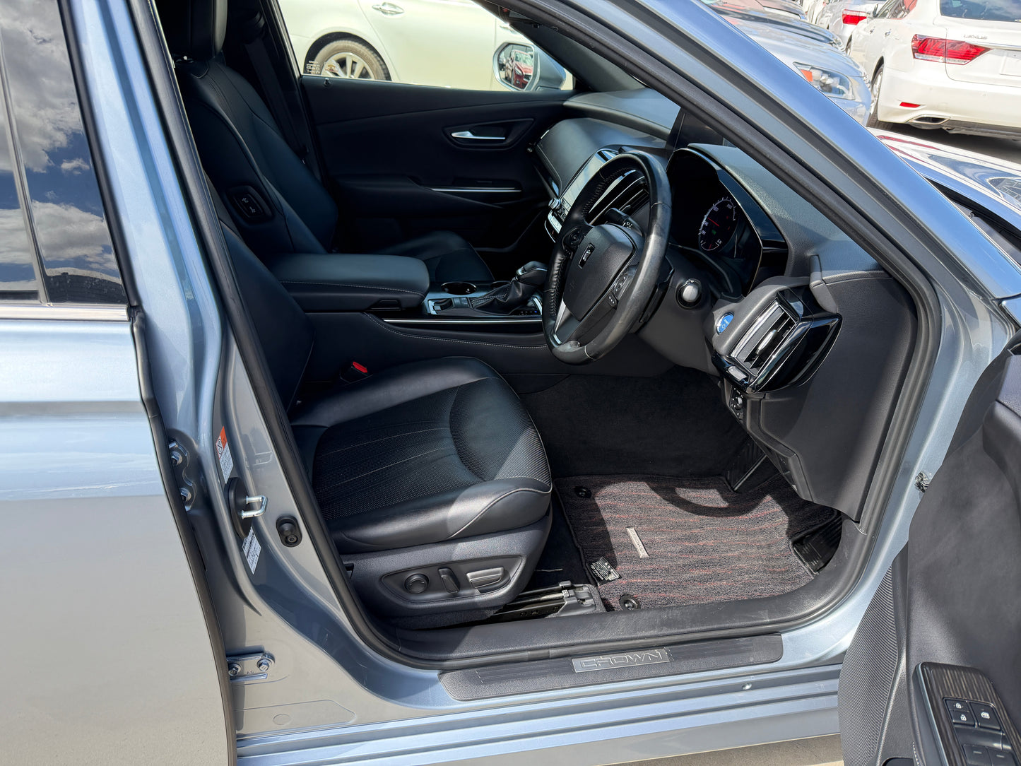 Interior of the 2019 Toyota Crown 2.5L Hybrid G Executive Edition Luxury Sedan showcasing comfortable seating and modern dashboard.
