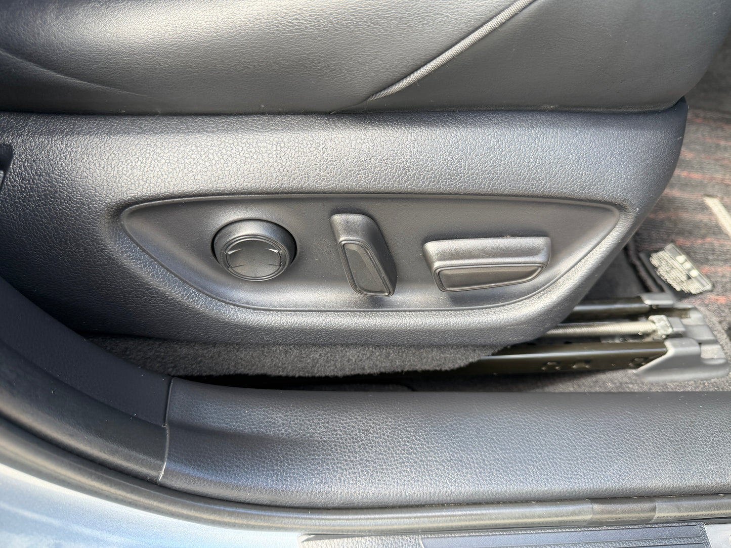 2019 Toyota Crown 2.5L Hybrid seat adjustment controls in luxury sedan interior.