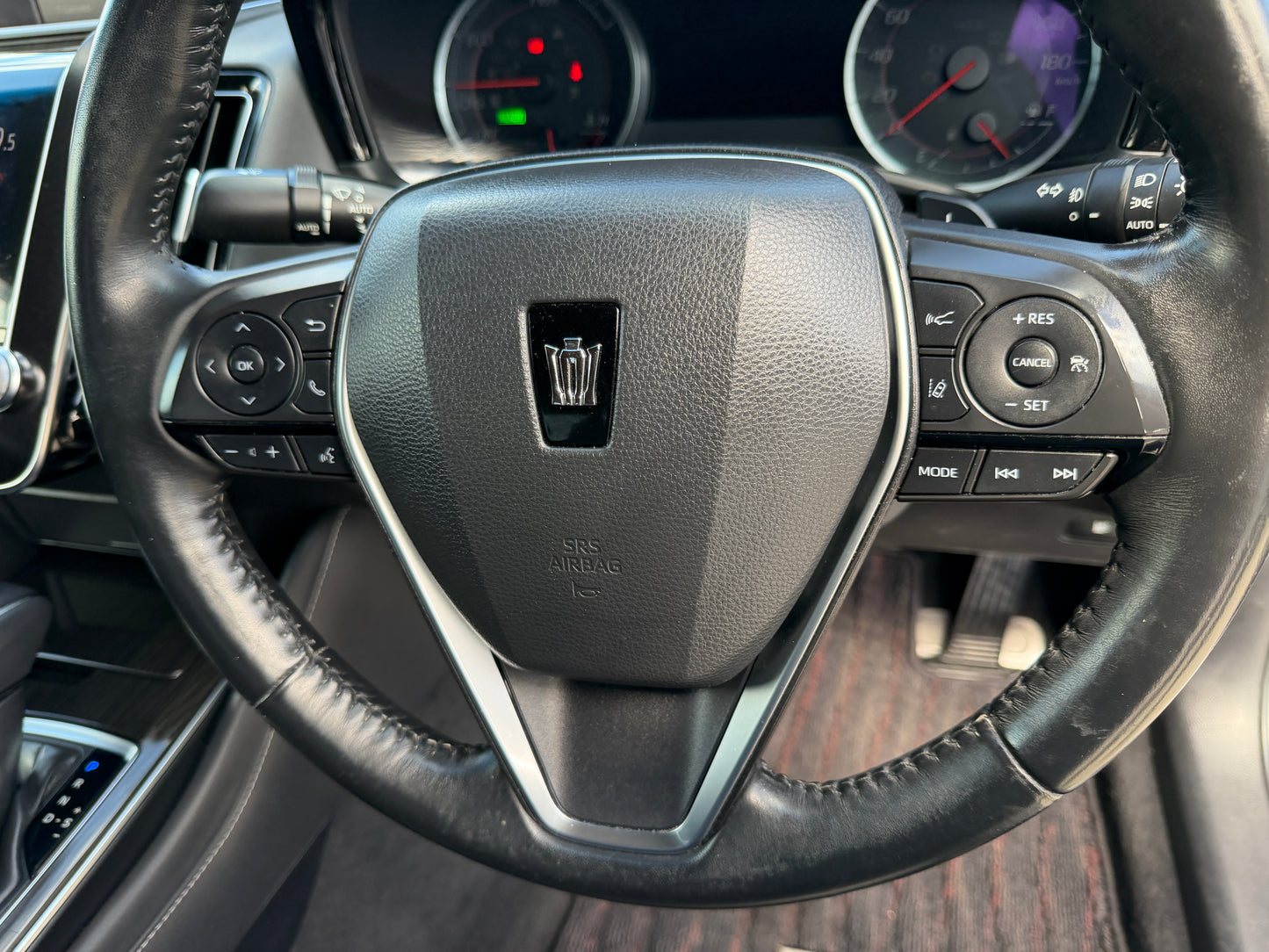 2019 Toyota Crown 2.5L Hybrid steering wheel controls with luxury design and features.