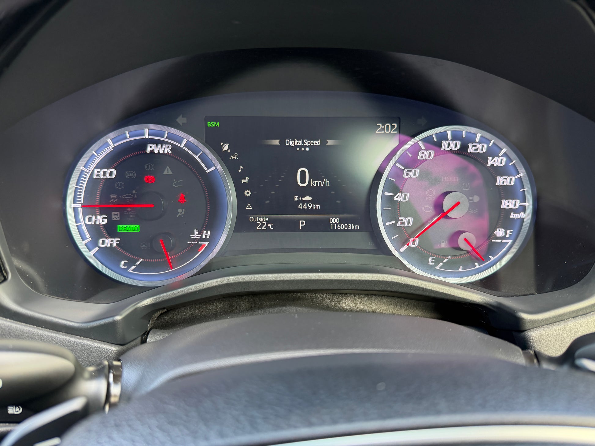 2019 Toyota Crown 2.5L Hybrid speedometer display showing digital speed and RPM gauges.