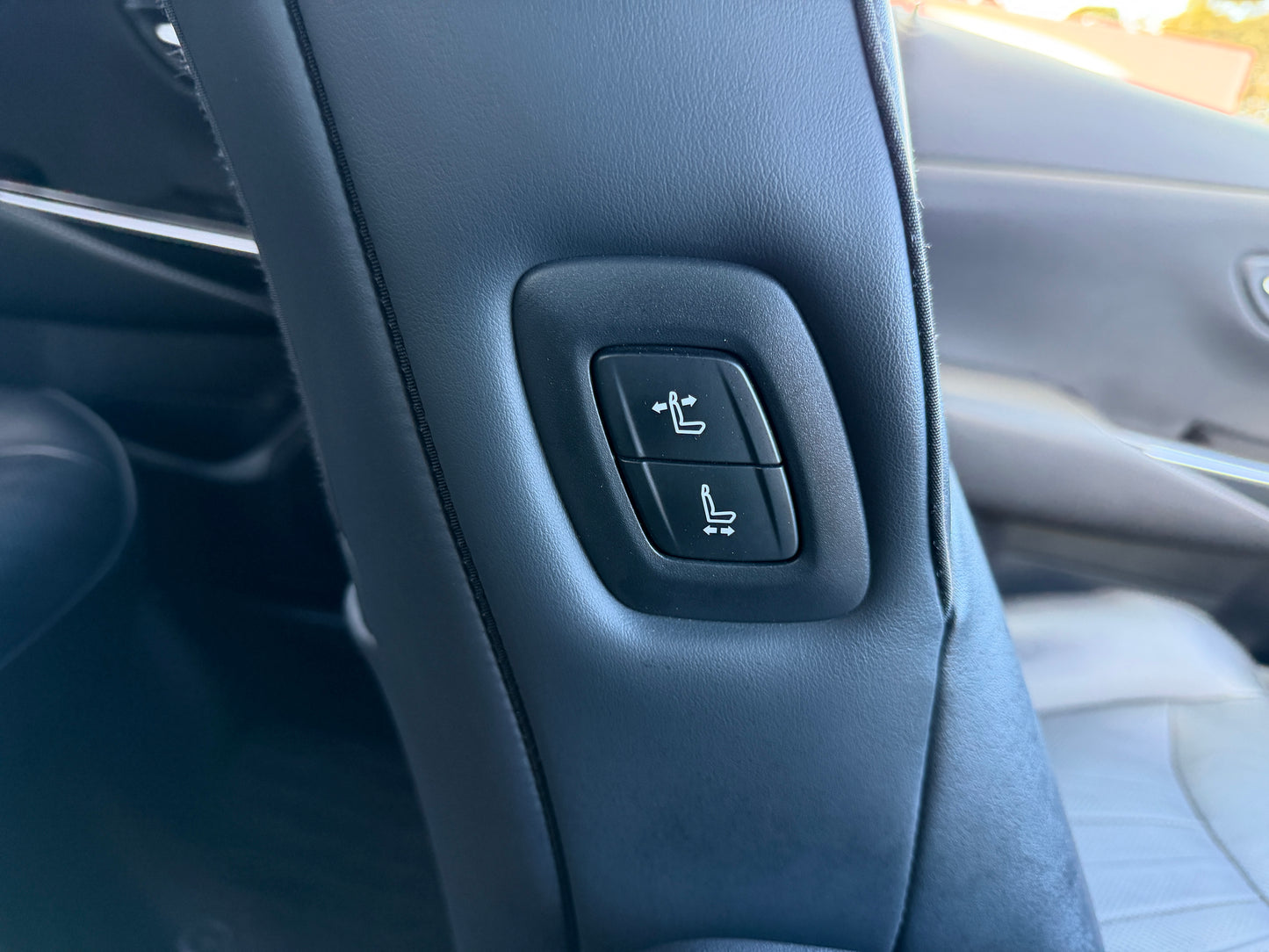 2019 Toyota Crown 2.5L Hybrid seat adjustment controls in luxury sedan interior.
