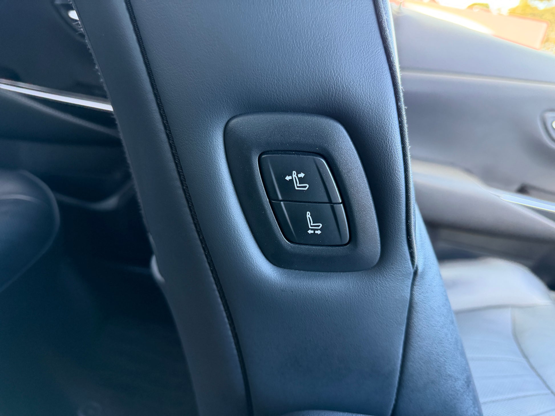 2019 Toyota Crown 2.5L Hybrid seat adjustment controls in luxury sedan interior.