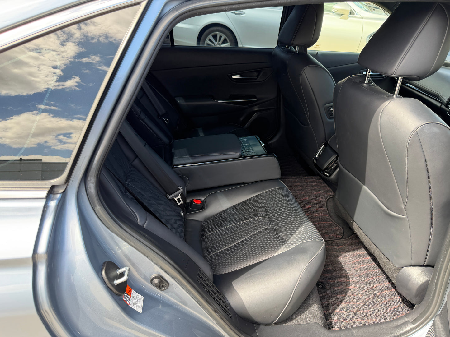 Interior view of the backseat of a 2019 Toyota Crown 2.5L Hybrid G Executive Edition Luxury Sedan.
