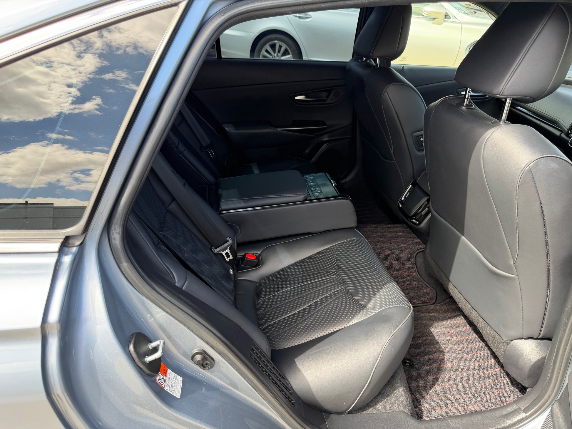 Interior view of the backseat of a 2019 Toyota Crown 2.5L Hybrid G Executive Edition Luxury Sedan.