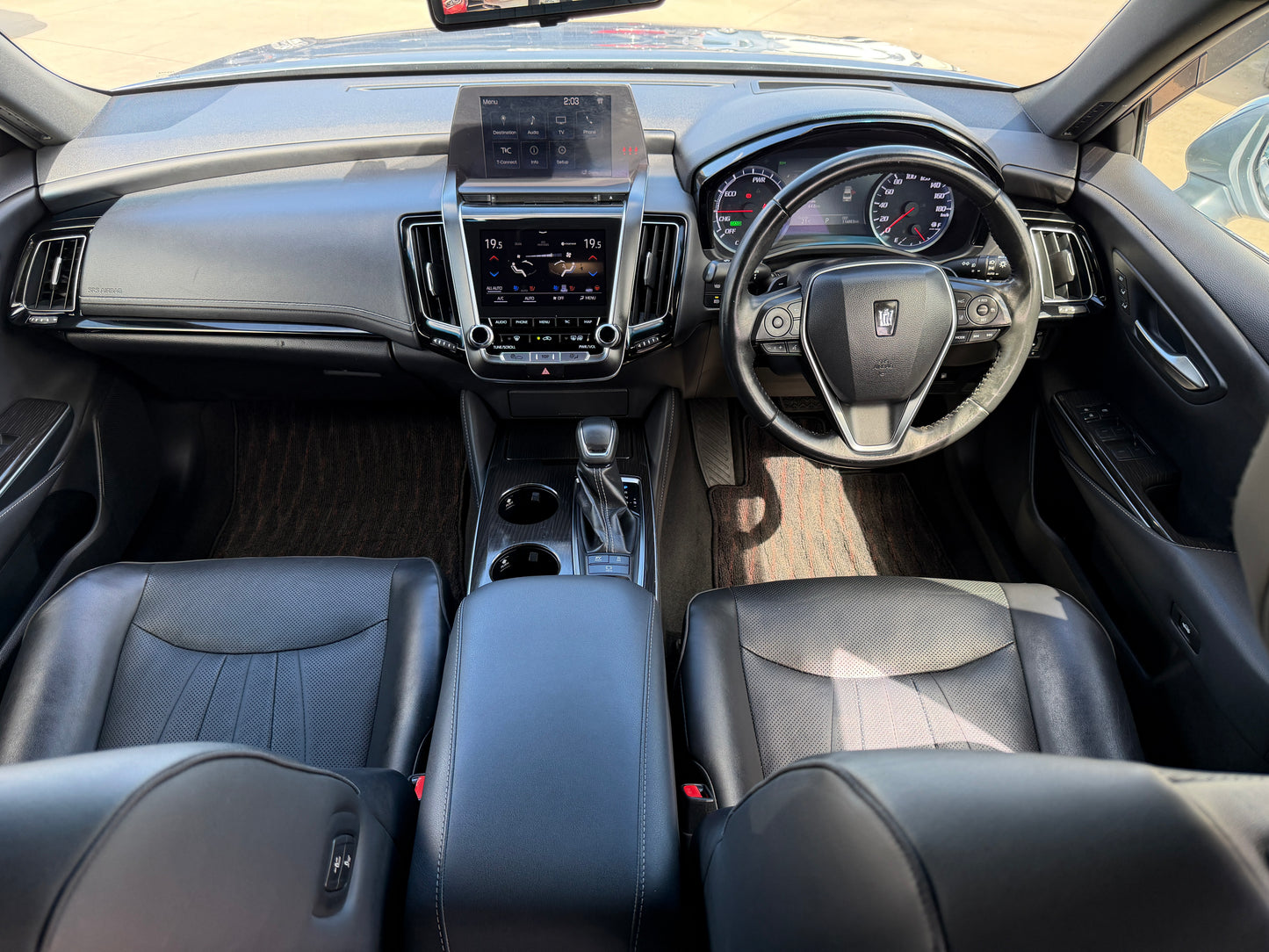 Interior view of a 2019 Toyota Crown 2.5L Hybrid G Executive Edition luxury sedan showcasing premium features.