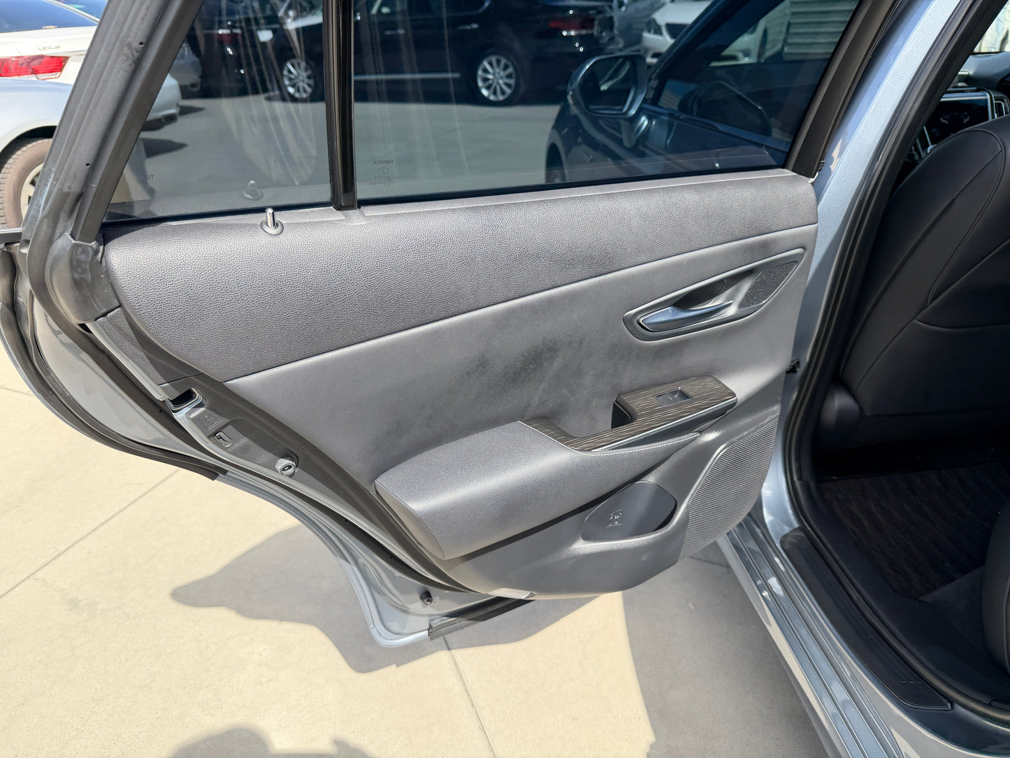 Interior view of the door panel of a 2019 Toyota Crown 2.5L Hybrid G Executive Edition Luxury Sedan.