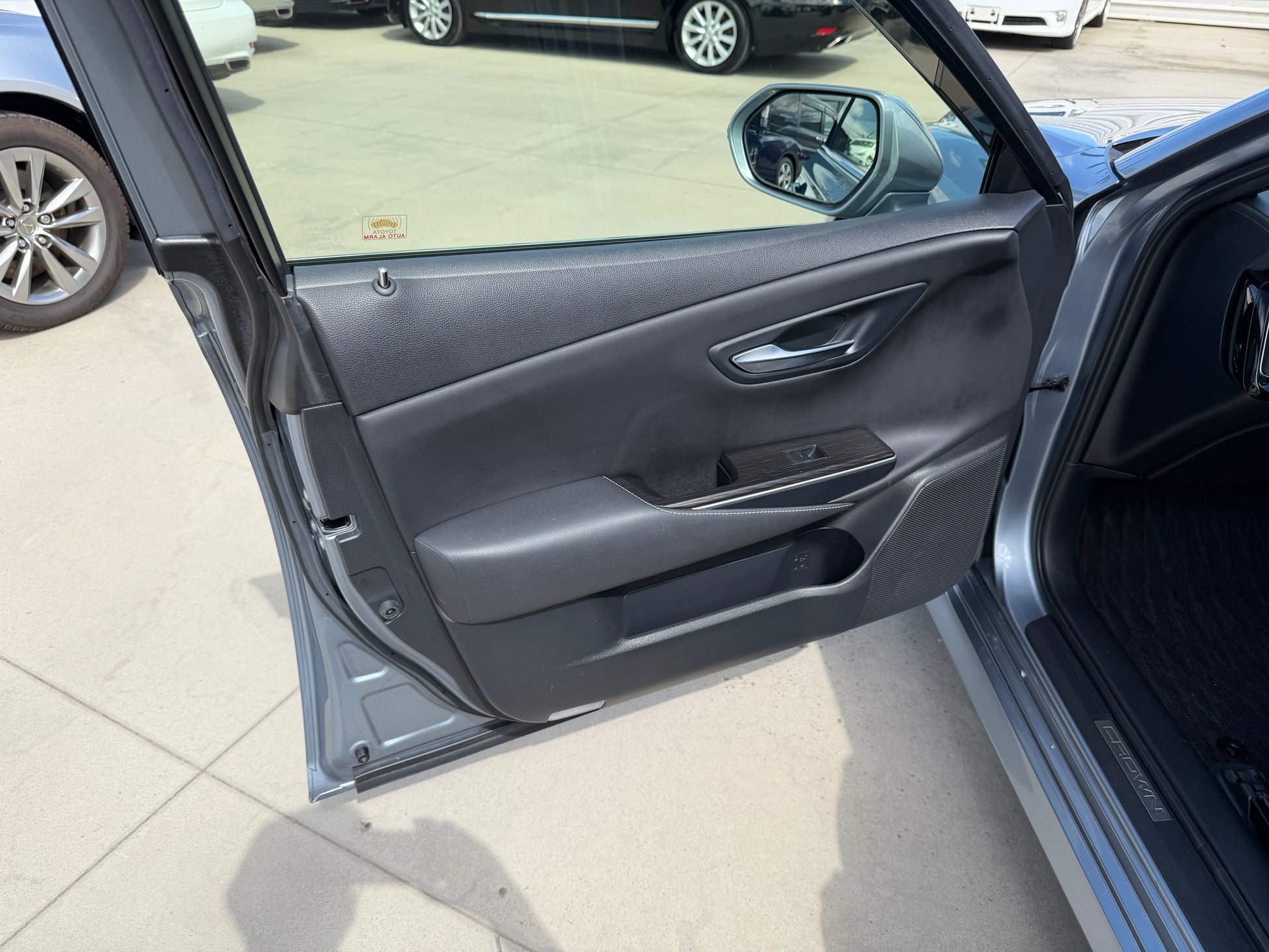 Interior view of 2019 Toyota Crown 2.5L Hybrid G Executive Edition luxury sedan door.