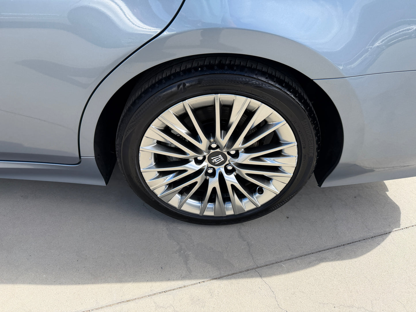 2019 Toyota Crown 2.5L Hybrid luxury sedan wheel close-up showcasing premium alloy rim design.