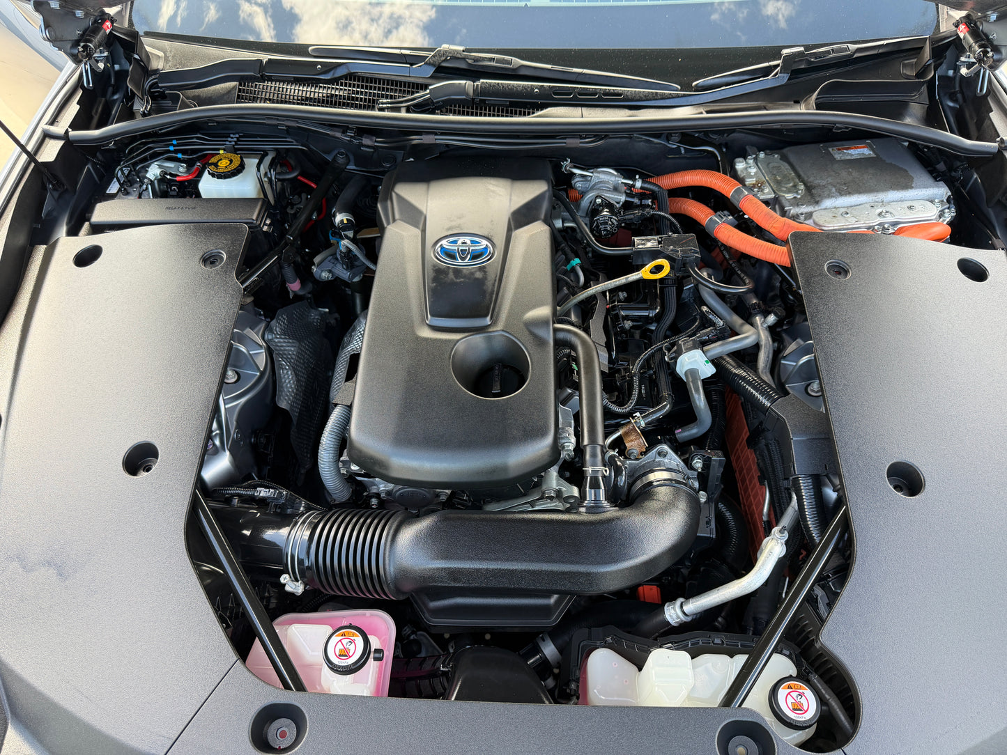 2019 Toyota Crown 2.5L Hybrid engine compartment showcasing hybrid technology and performance.