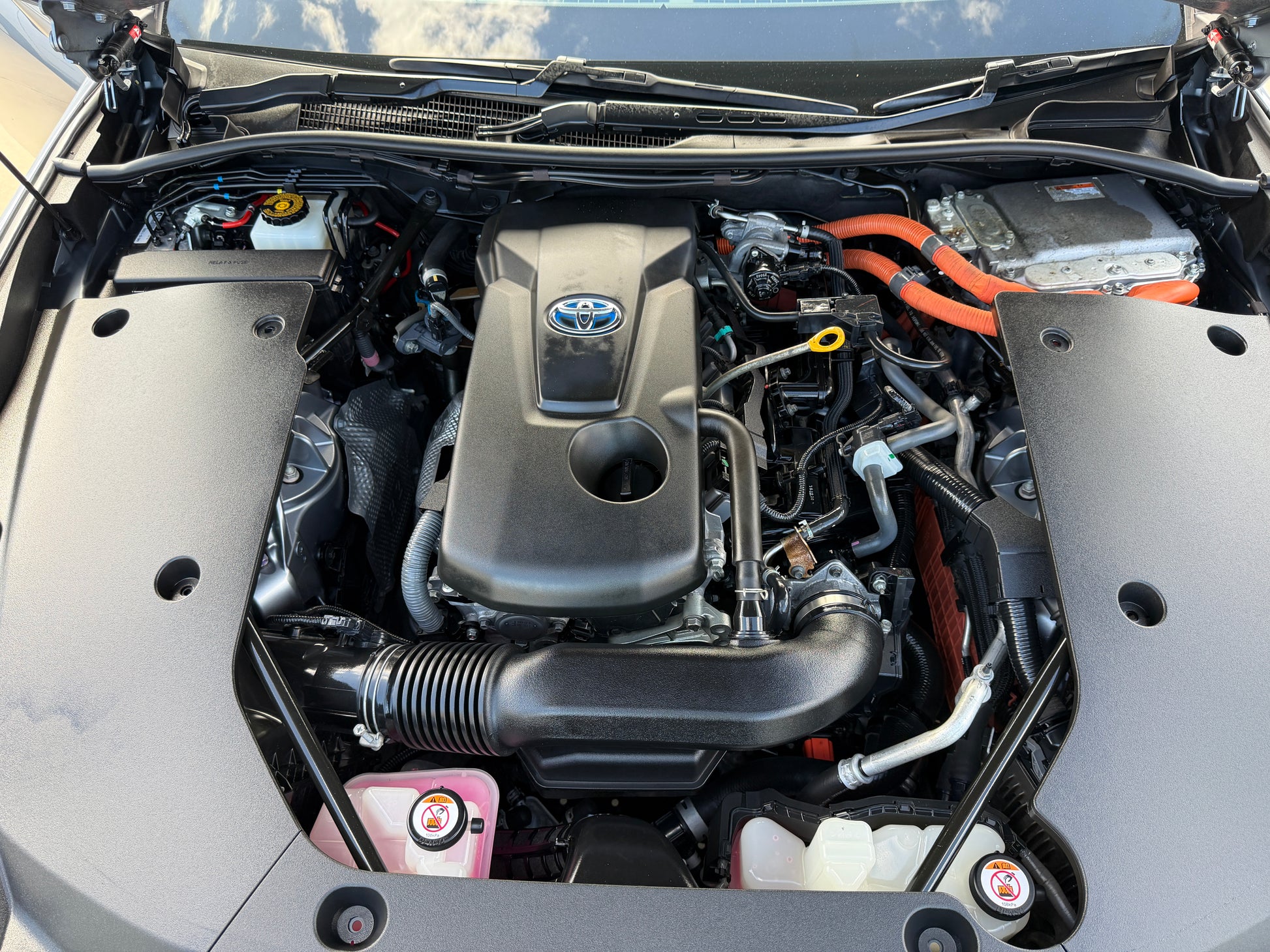 2019 Toyota Crown 2.5L Hybrid engine compartment showcasing hybrid technology and performance.