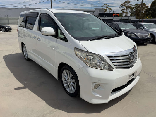 2009 Toyota Alphard V6 3,5L 350S 8 seats in white color parked at a dealership with clear sky background.