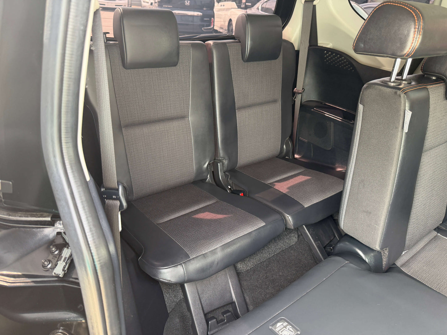 Interior view of the backseat in a 2018 Toyota Sienta 1.5L Hybrid G Cuero Package 7 seater.