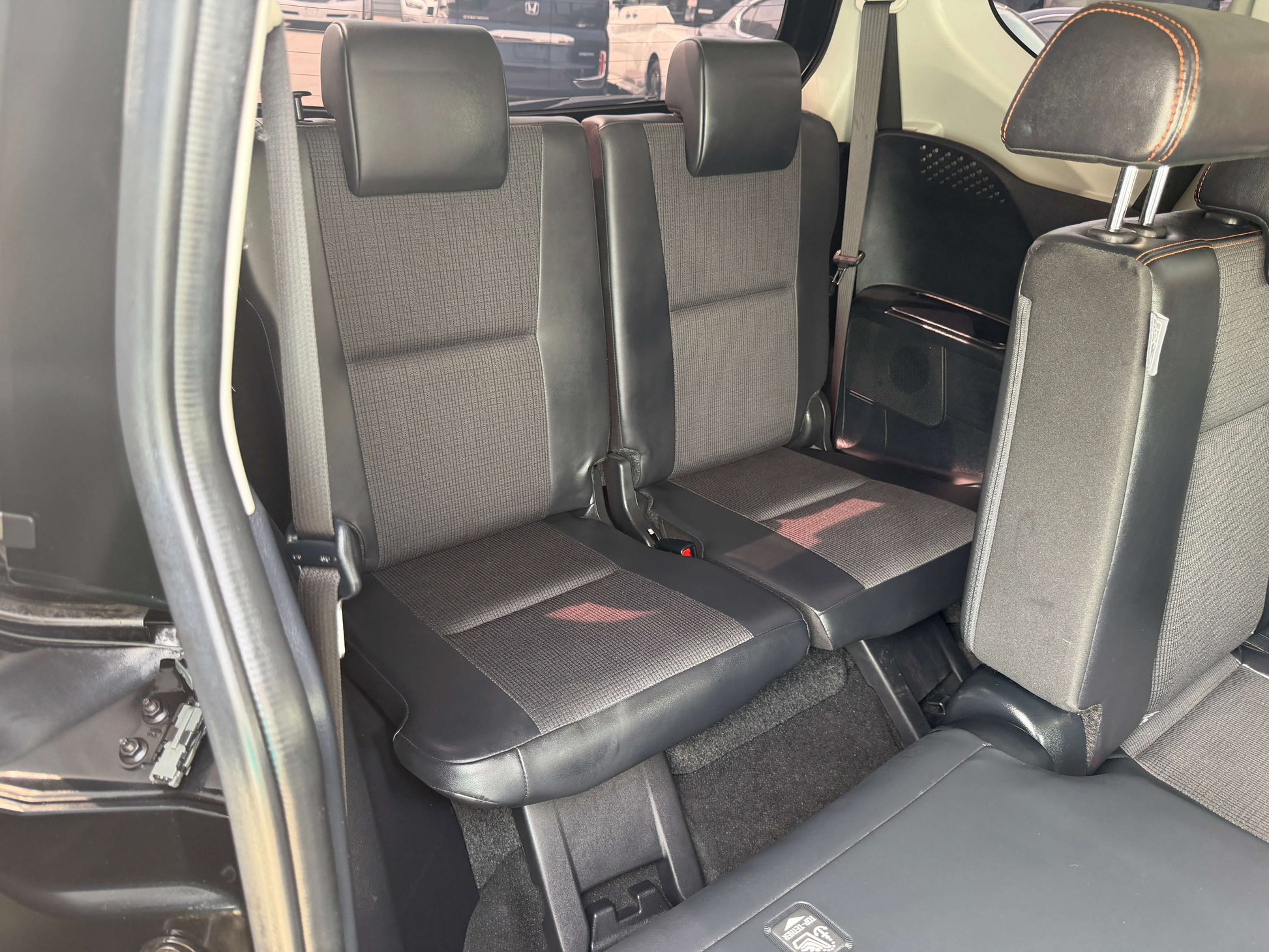 Interior view of the backseat in a 2018 Toyota Sienta 1.5L Hybrid G Cuero Package 7 seater.