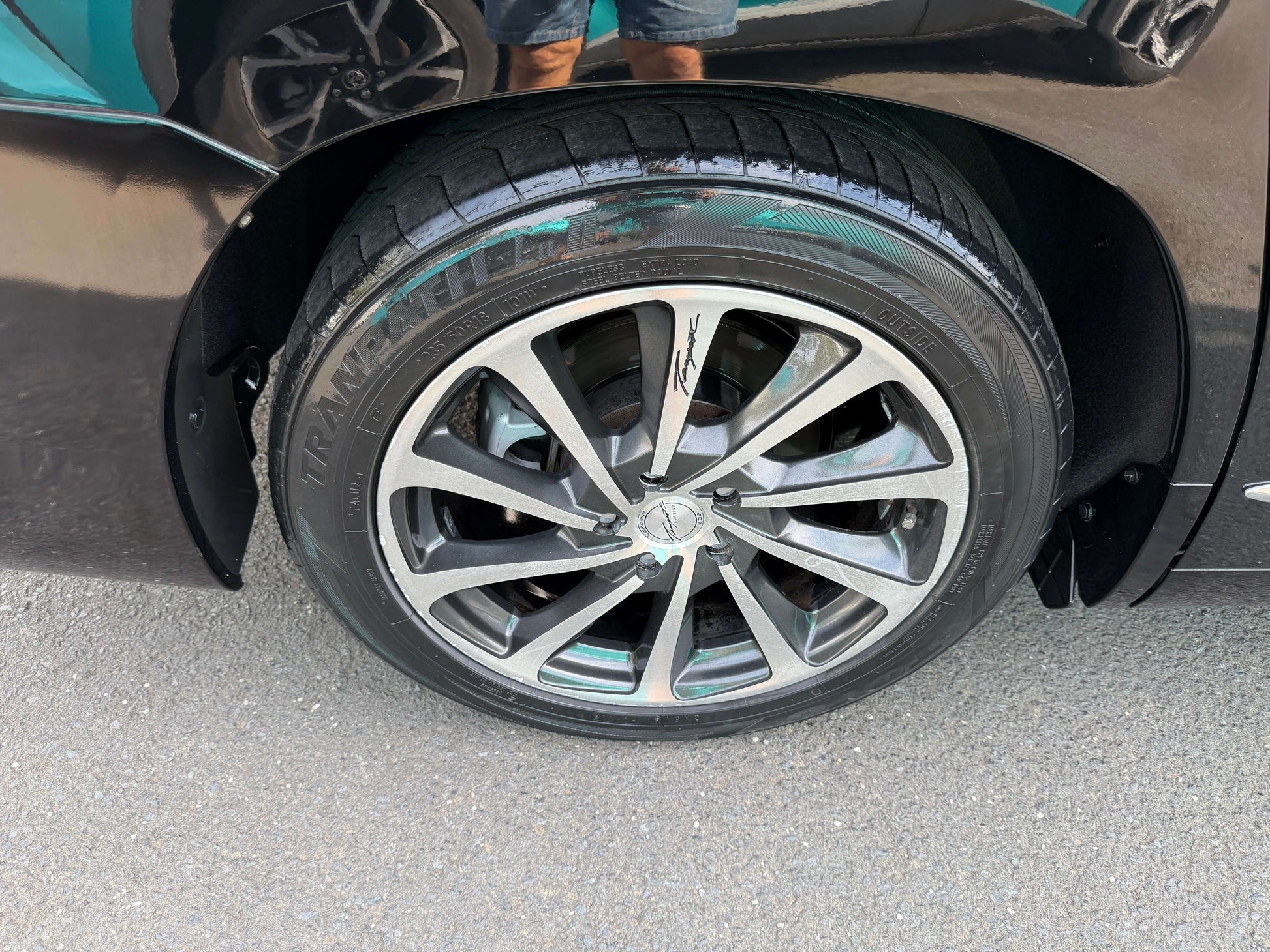 Close-up of the alloy wheel on a 2010 Toyota Vellfire 2.4L, showcasing the sleek design and tire details.