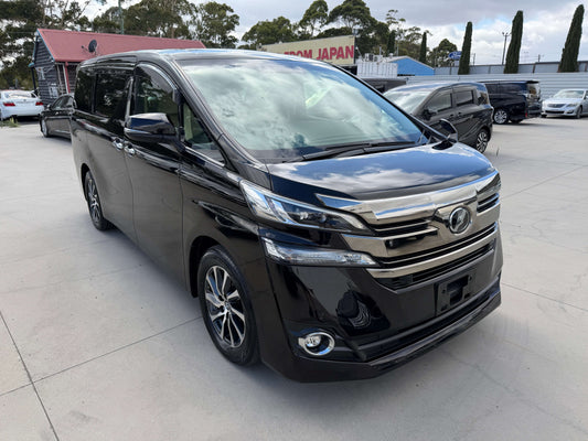 2015 Toyota Vellfire 2.5L V Edition black luxury people mover parked in a lot.