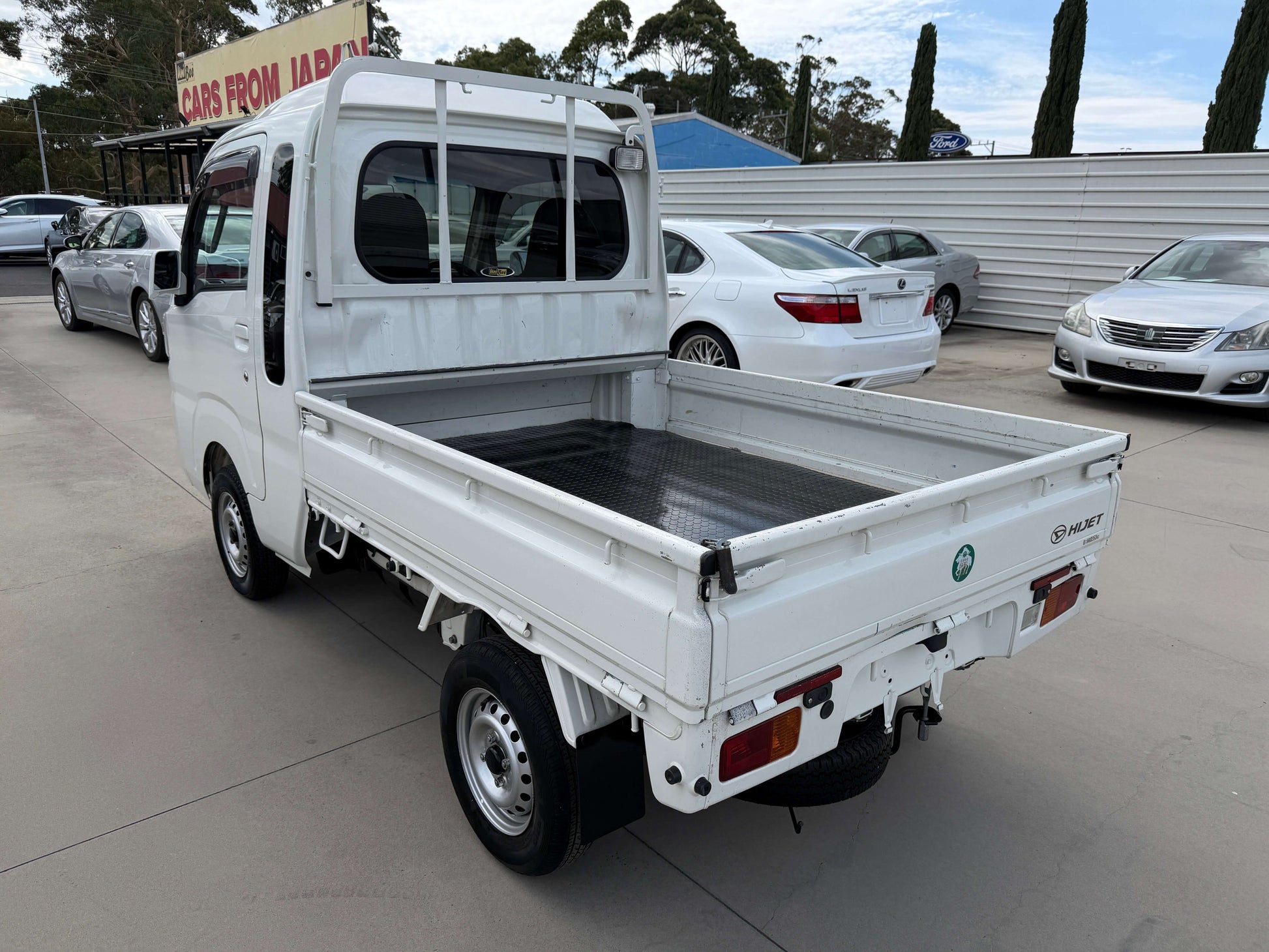 2021 Daihatsu Hijet Truck 660 Jumbo SA IIIt back view, showcasing the truck bed and design.