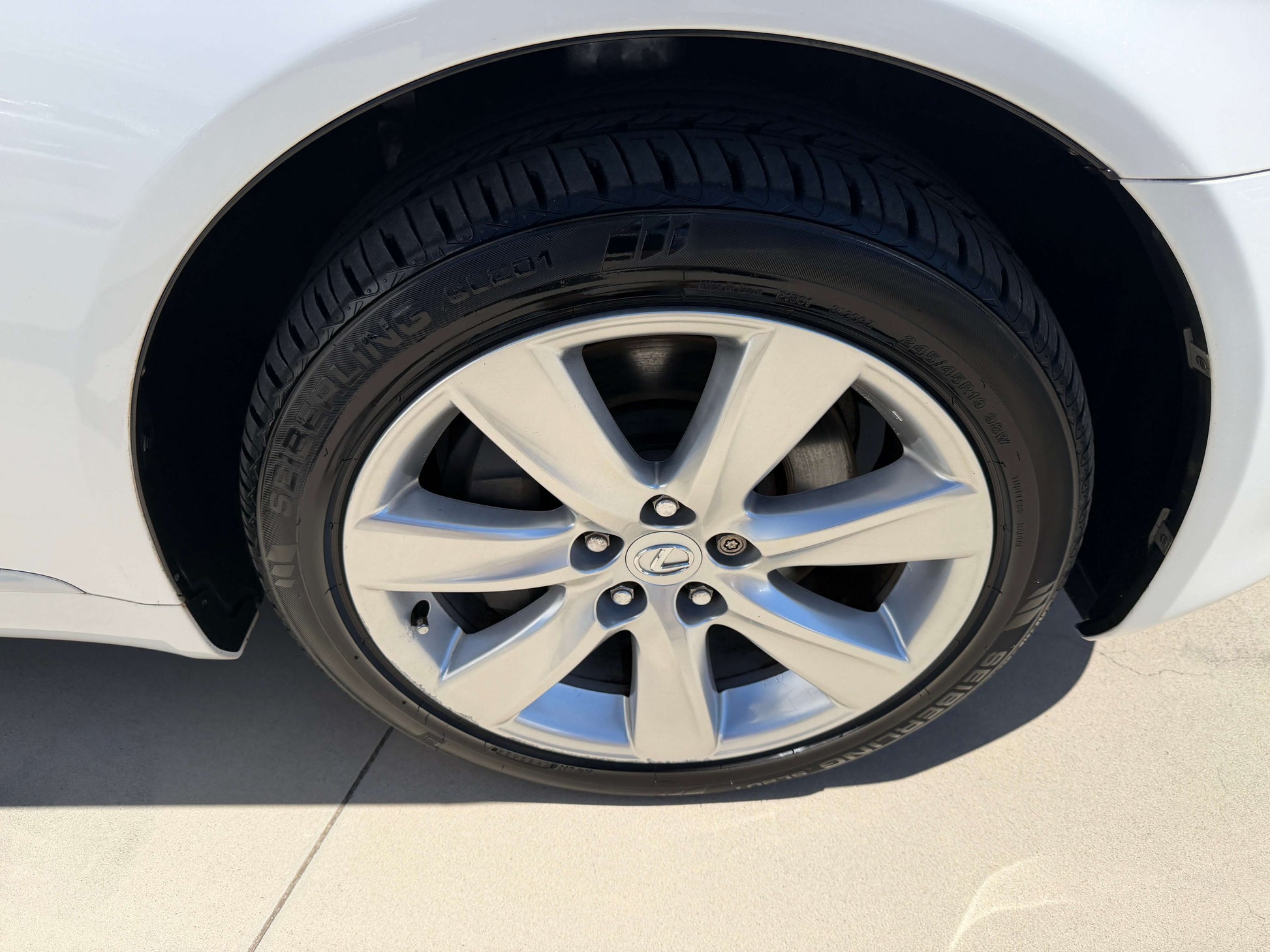 Close-up view of the wheel and tire of a 2007 Lexus LS600h AWD V8 5.0L Hybrid luxury sedan.