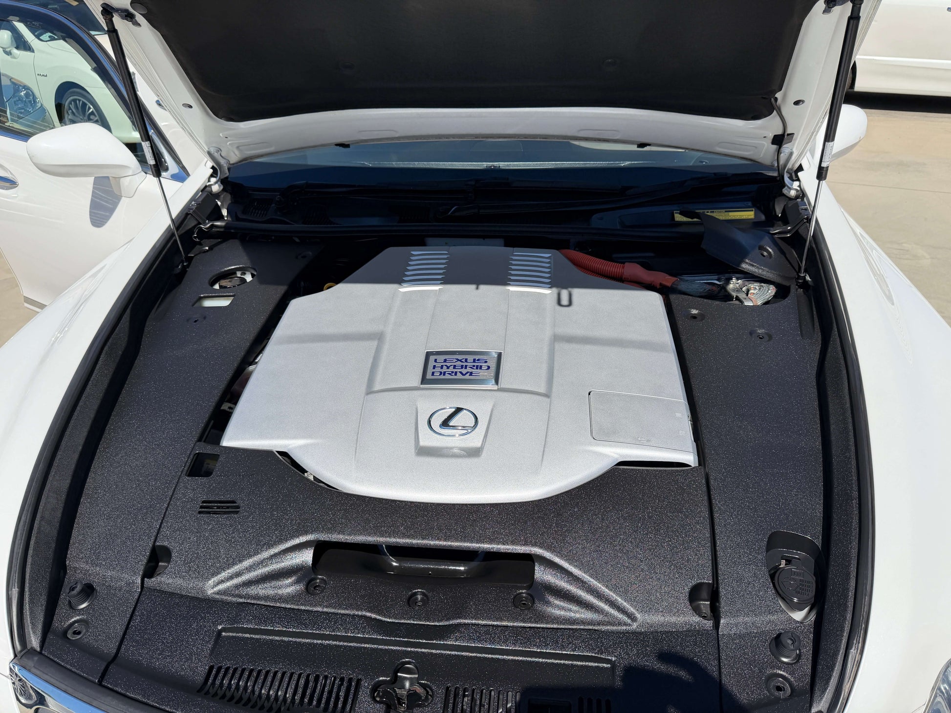 2007 Lexus LS600h AWD V8 5.0L Hybrid engine under the hood, showcasing advanced engineering and luxury features.