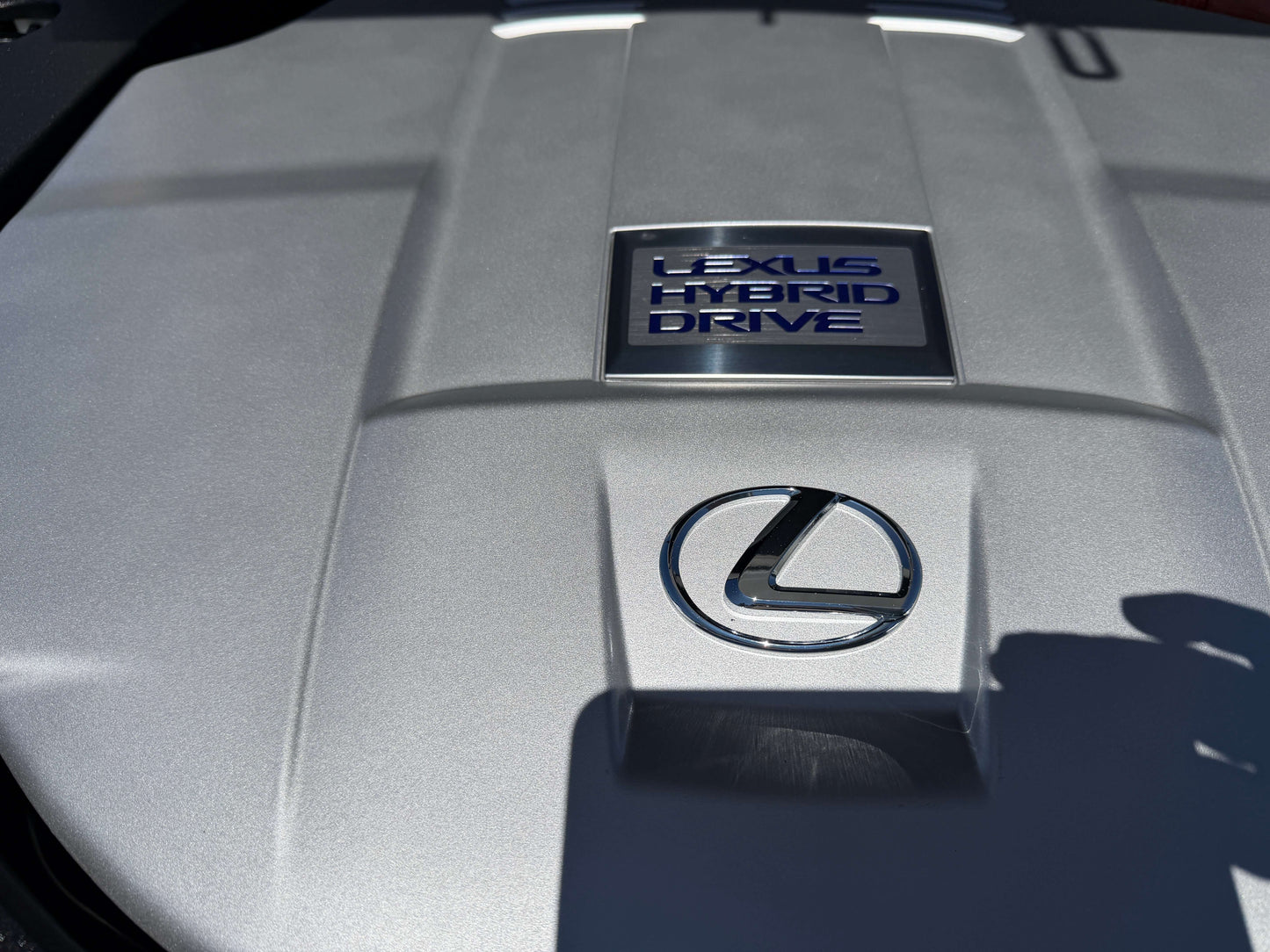 2007 Lexus LS600h AWD V8 5.0L Hybrid engine cover with Lexus Hybrid Drive badge.