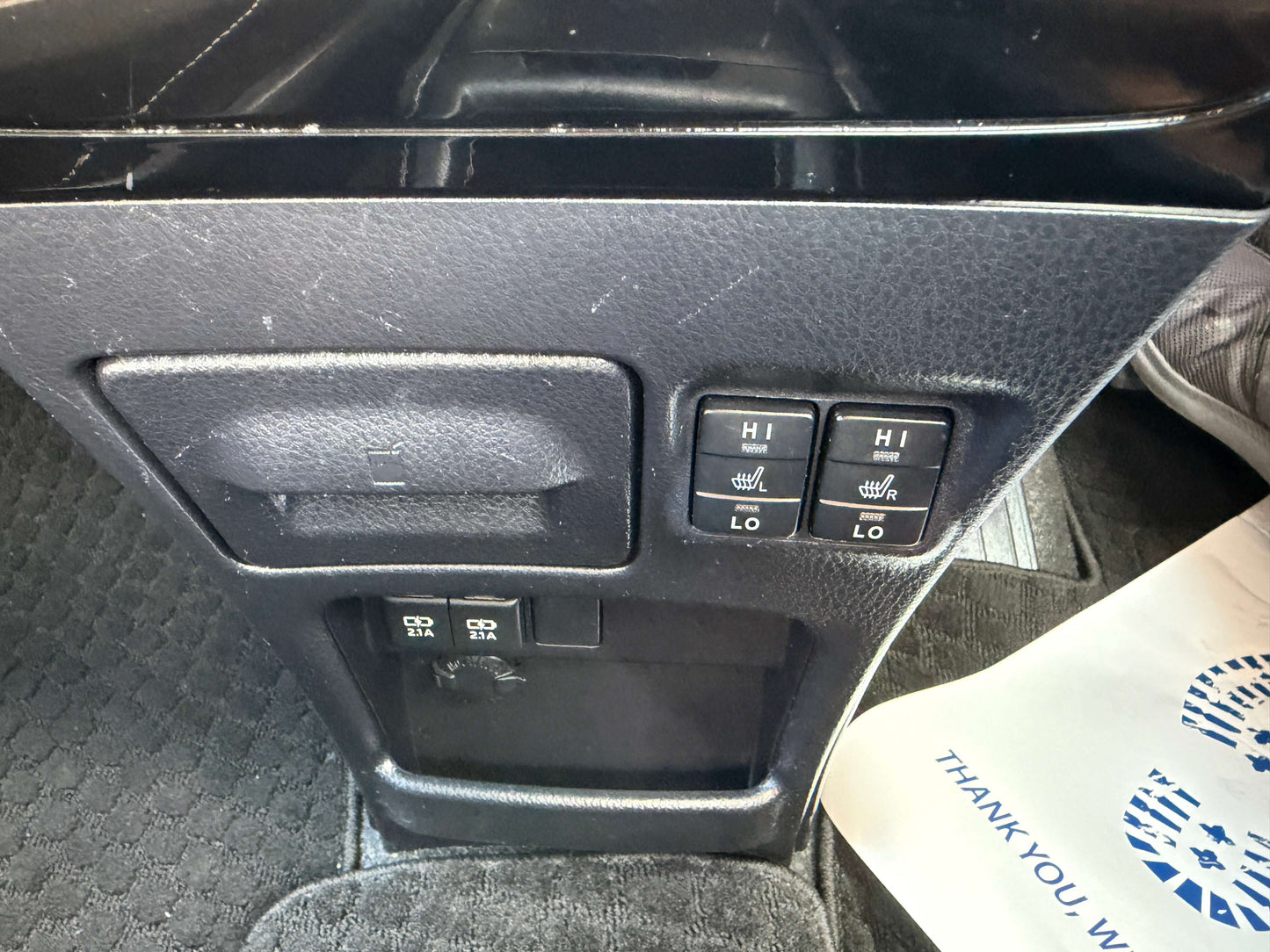 Interior control panel of 2018 Toyota Noah 1.8L Hybrid with seat heater and power window buttons.