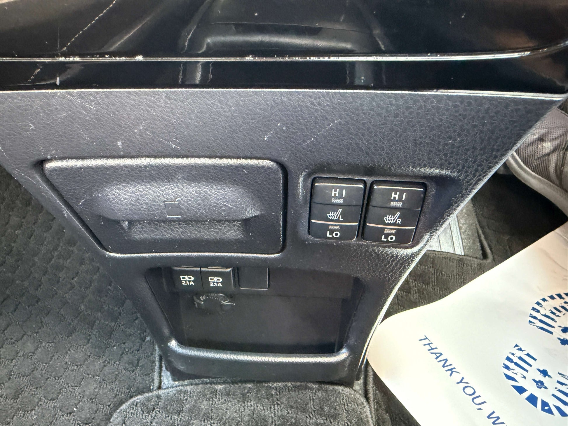Interior control panel of 2018 Toyota Noah 1.8L Hybrid with seat heater and power window buttons.