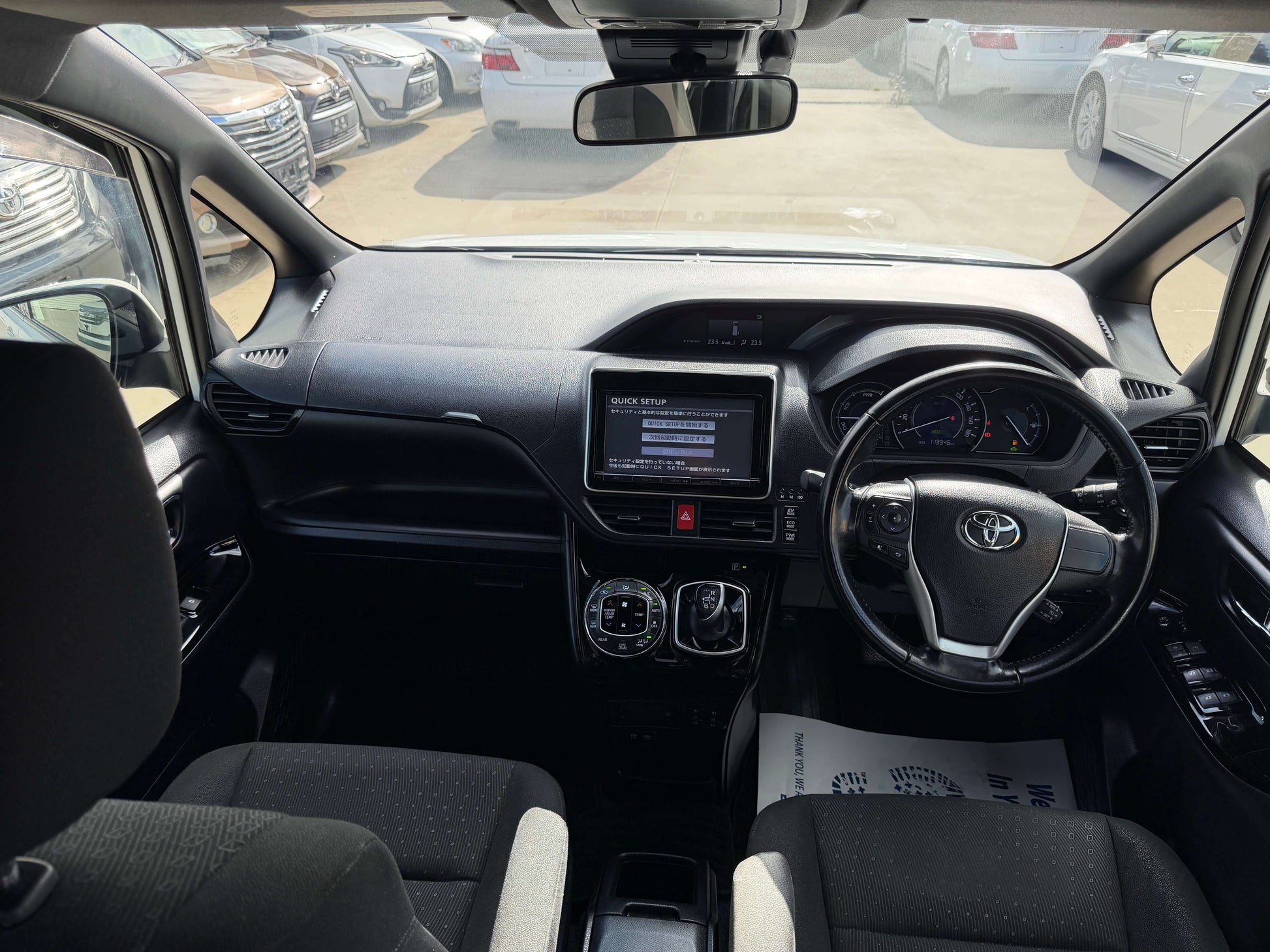 Interior view of a 2018 Toyota Noah 1.8L Hybrid G Premium Edition showcasing dashboard and seating.