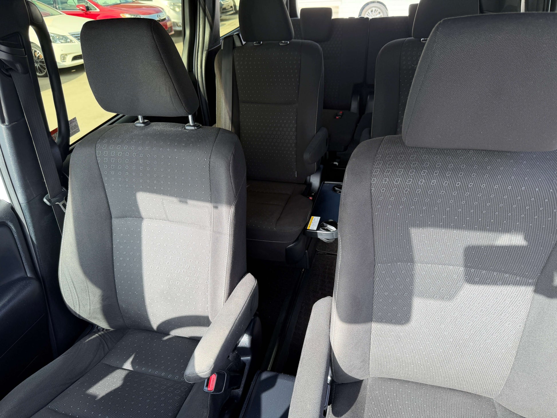 Interior view of the 2018 Toyota Noah 1.8L Hybrid G Premium Edition 7 seater showing spacious black seating.