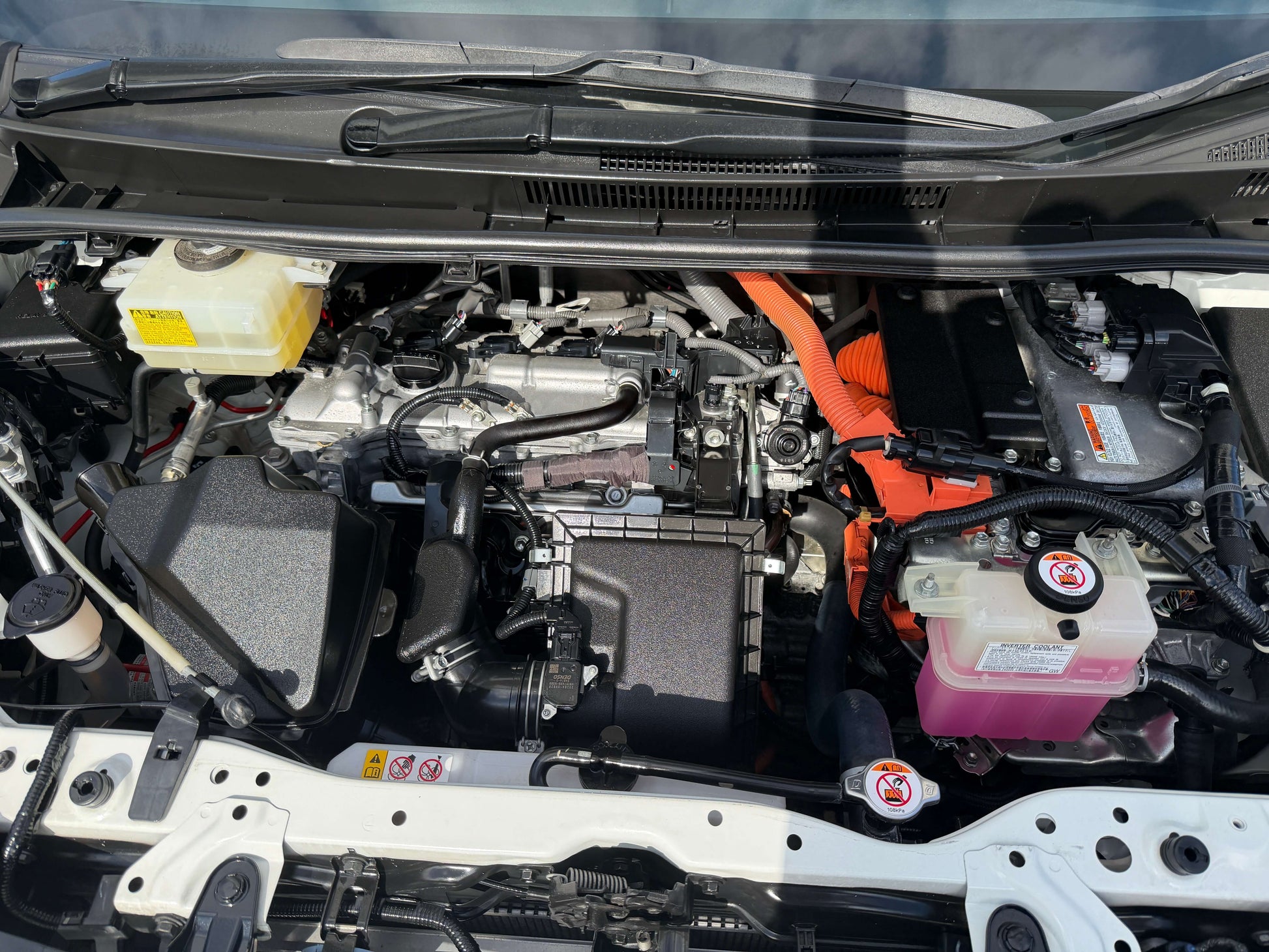 2018 Toyota Noah 1.8L Hybrid G Premium Edition engine compartment showing hybrid engine components.