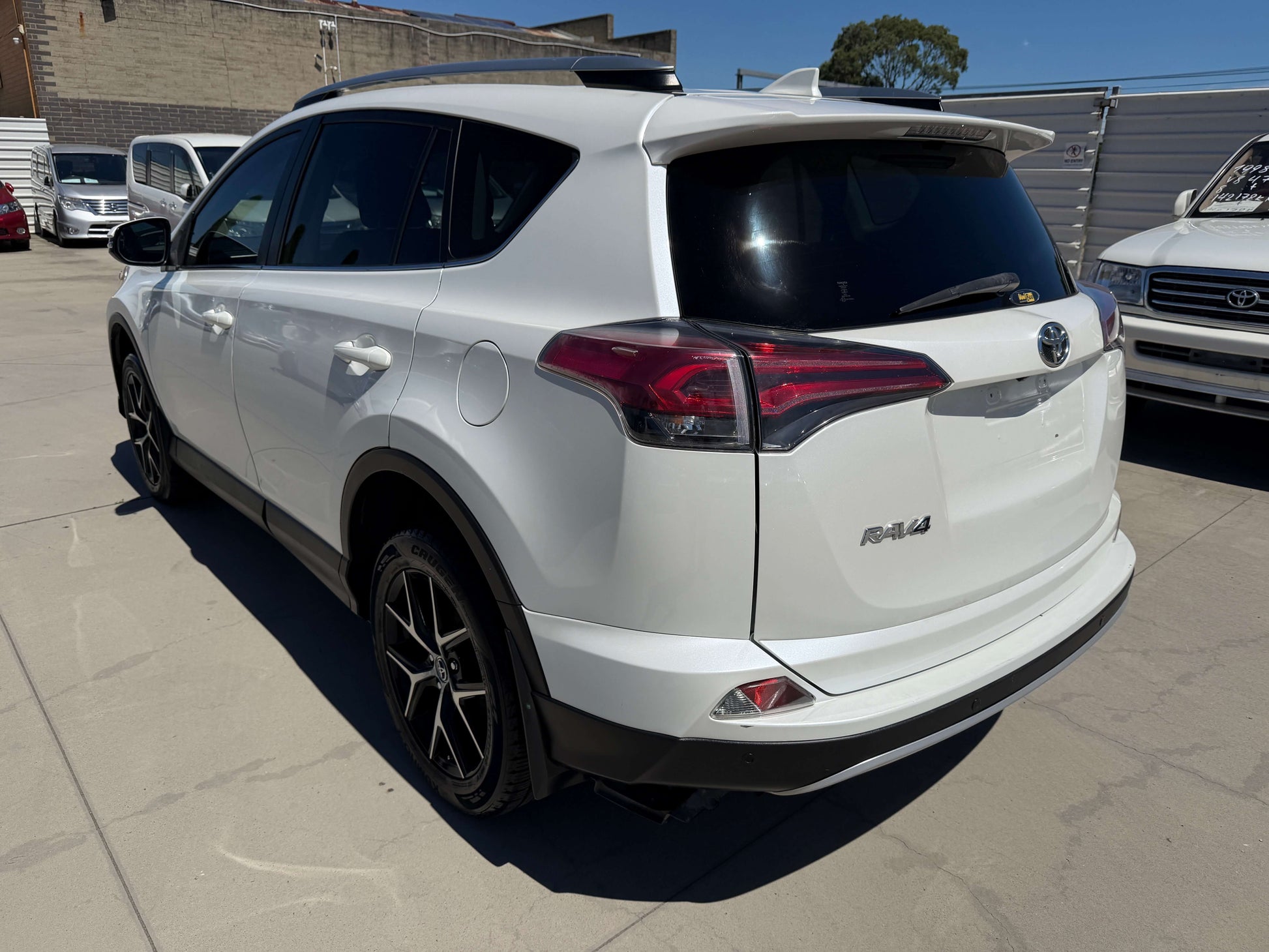 2016 Toyota RAV4 rear view showcasing the sleek design and modern features of the SUV.