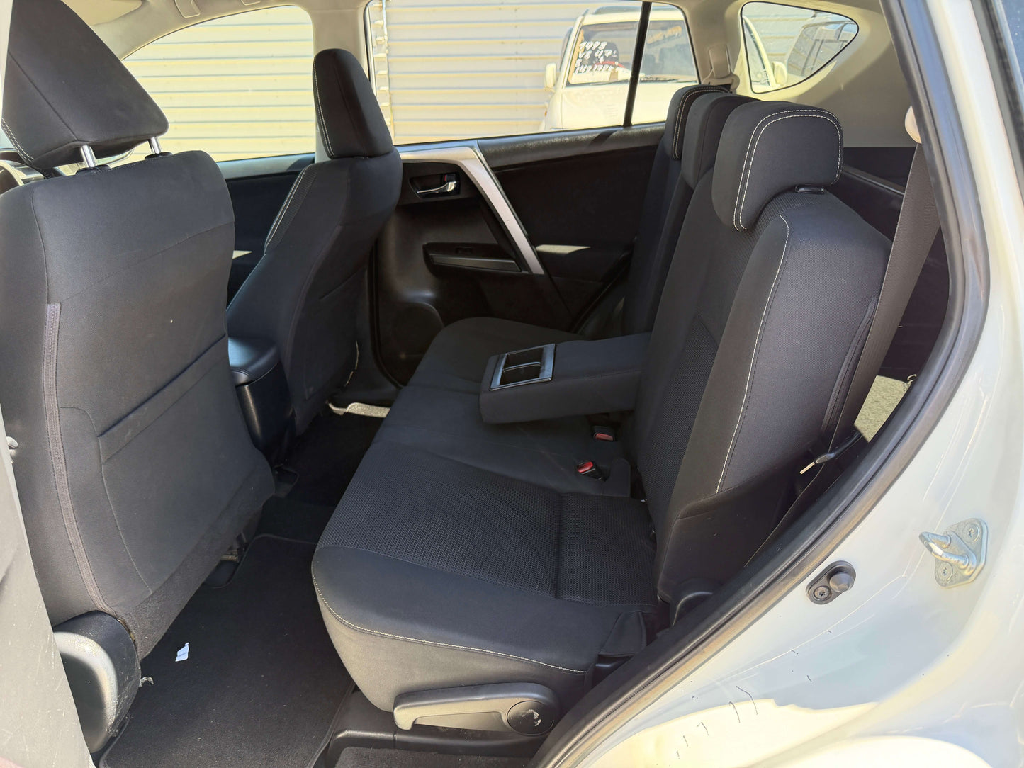 2016 Toyota RAV4 interior view showing spacious back seat area with comfortable seating.