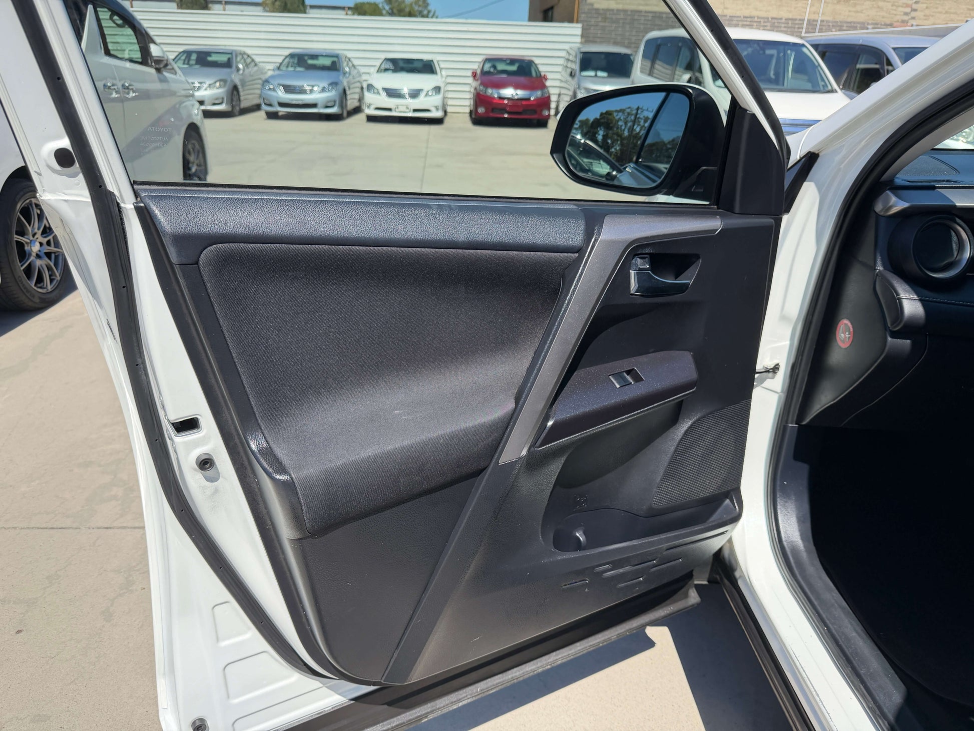 Interior view of 2016 Toyota RAV4 2.0L GX Wagon Auto showing driver's side door.