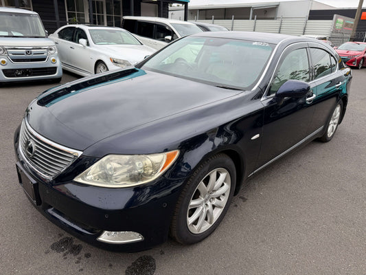2006 Lexus LS460 V8 4.6L luxury sedan in navy blue exterior with prominent front grill, showcasing premium design details.