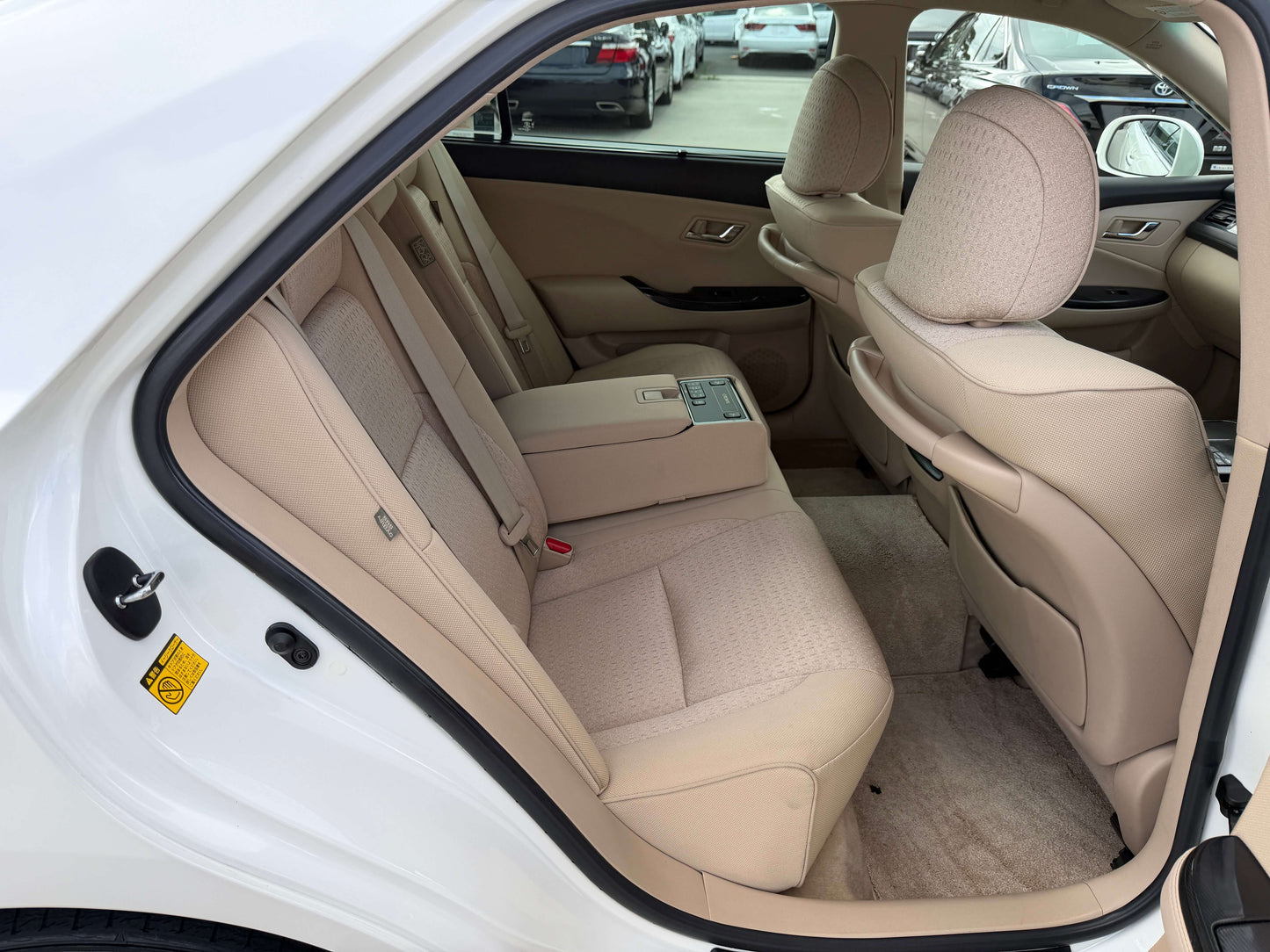 Interior view of the back seats in a 2009 Toyota Crown V6 3.5L Hybrid G-Edition Luxury Sedan.