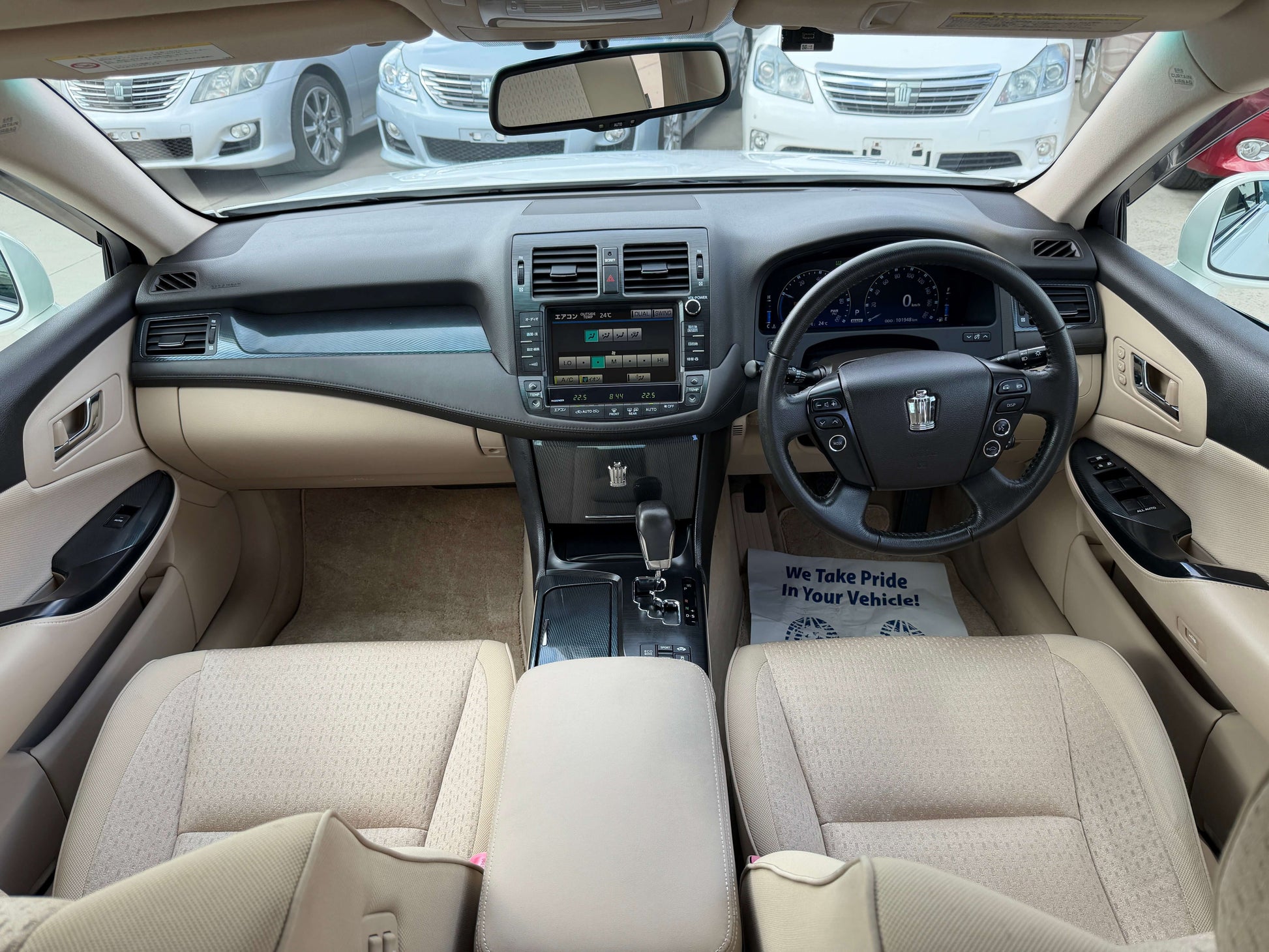 Interior view of a 2009 Toyota Crown V6 3.5L Hybrid G-Edition Luxury Sedan, featuring comfortable seating and modern dashboard.