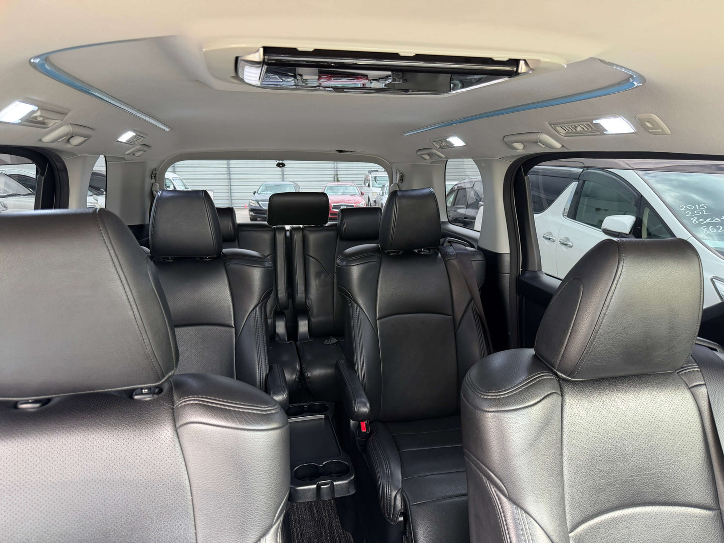 Interior view of the 2016 Toyota Alphard 2.5L SA Package luxury people mover with black leather seats.