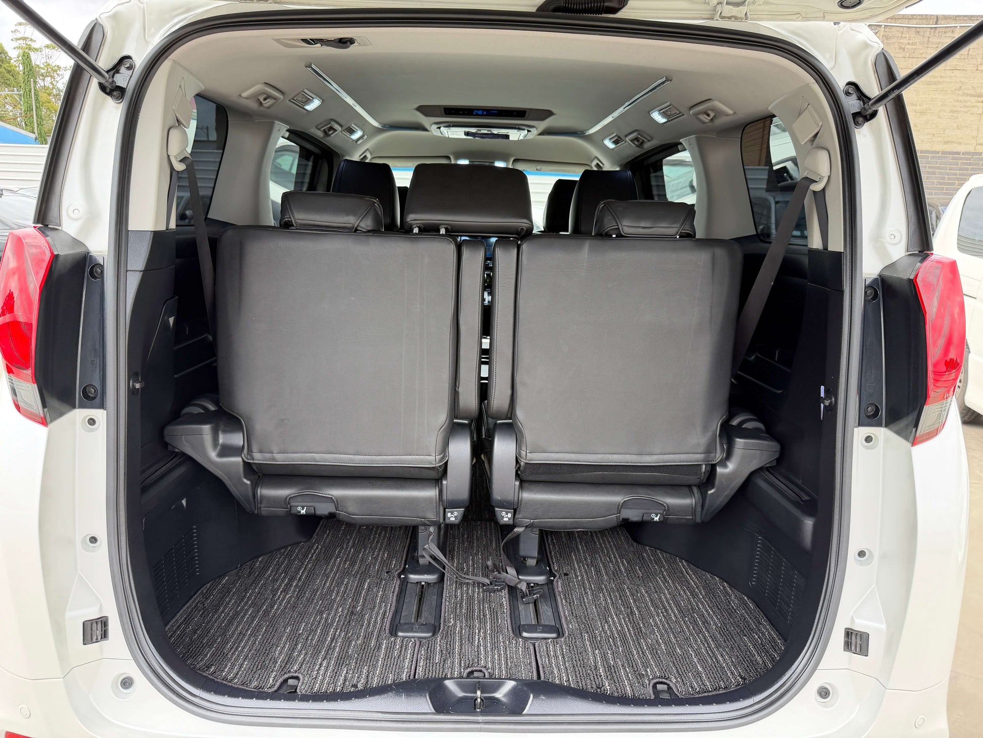 2016 Toyota Alphard 2.5L interior view showing rear passenger seats of luxury people mover.
