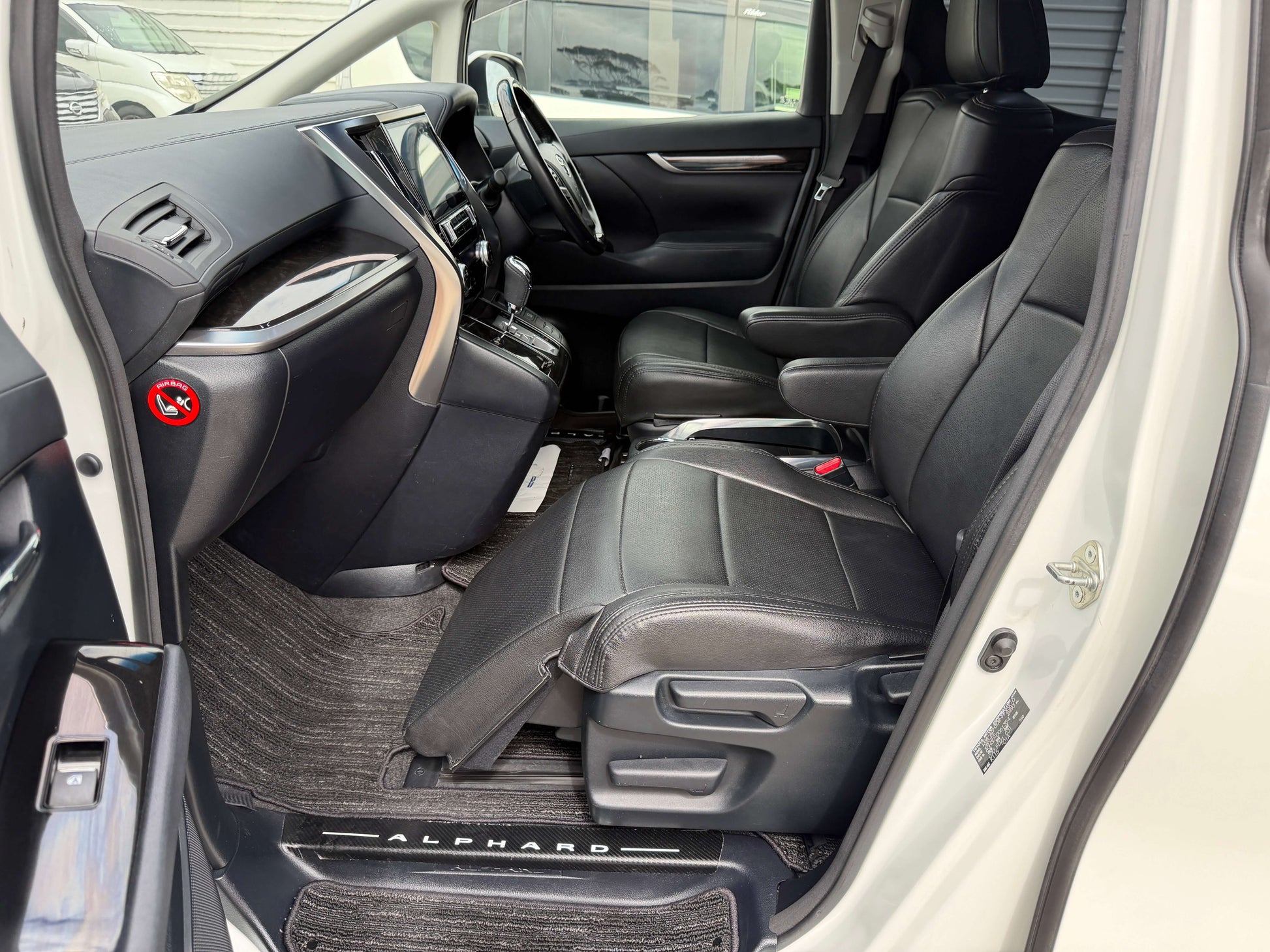 Interior view of a 2016 Toyota Alphard 2.5L SA Package luxury people mover showing black leather seats and dashboard.