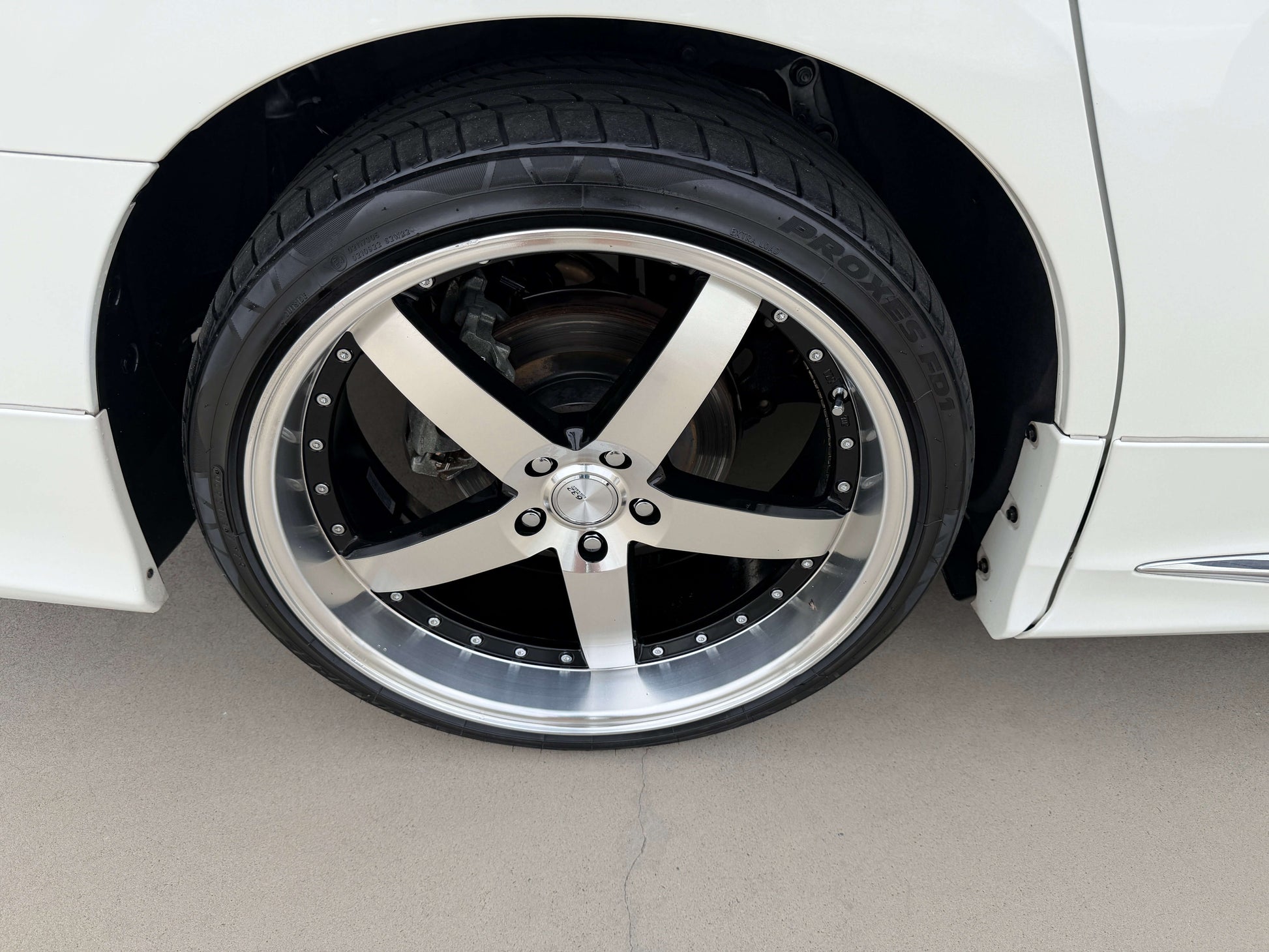 Close-up of a stylish alloy wheel on a 2016 Toyota Alphard 2.5L, showcasing modern design and high-performance tires.