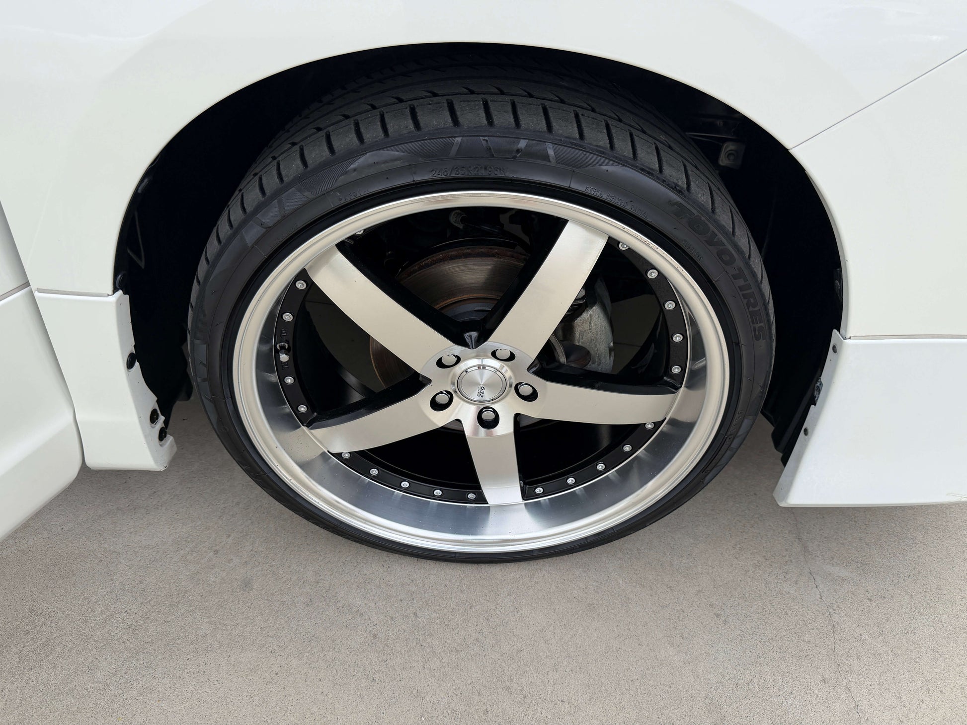 Close-up of a stylish alloy wheel with a black and silver finish on a 2016 Toyota Alphard 2.5L.