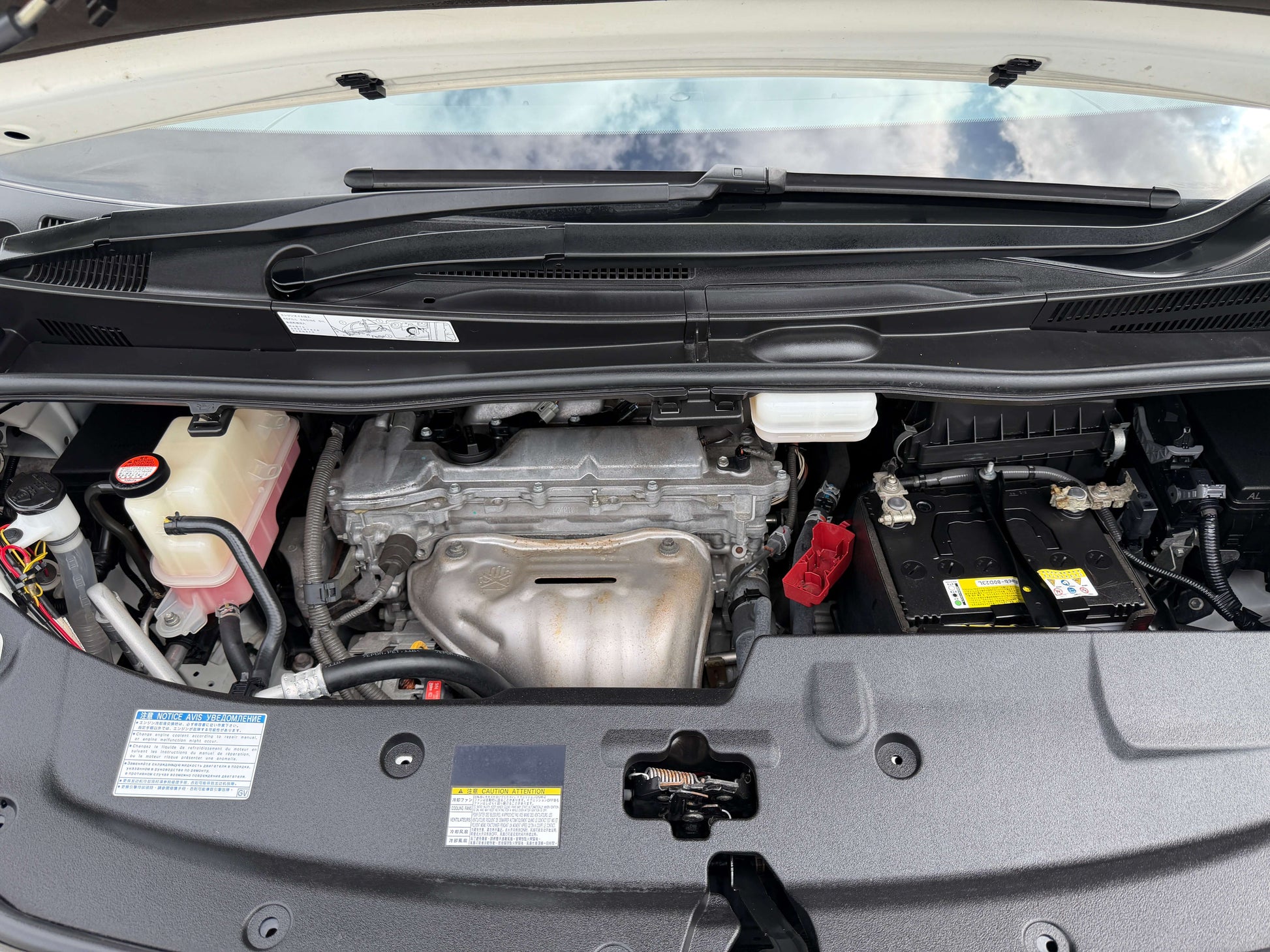 2016 Toyota Alphard 2.5L engine view under the hood showcasing components and layout.