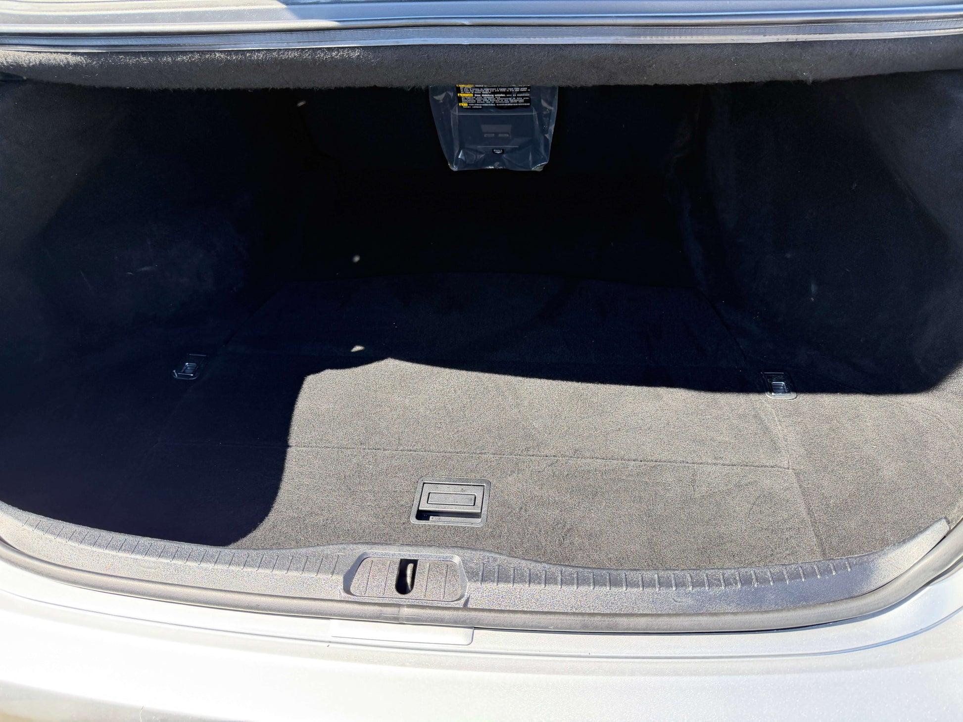Open trunk of a 2010 Lexus LS460 AWD V8 4.6L showing spacious interior and clean condition.