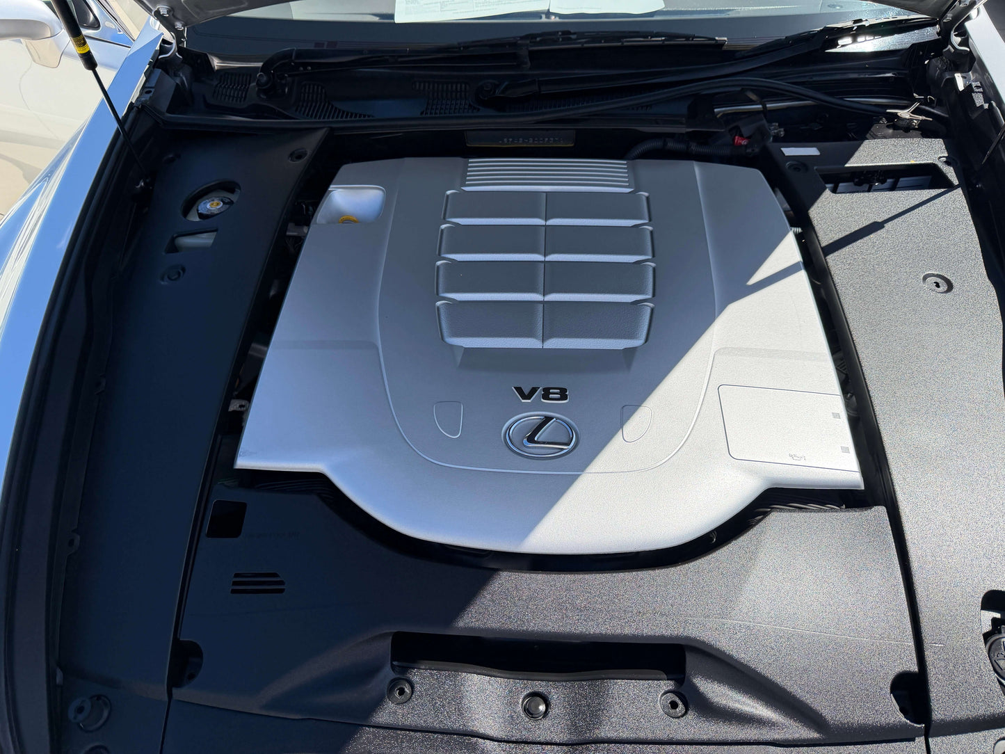 2010 Lexus LS460 AWD V8 4.6L engine bay view showcasing the V8 engine cover.