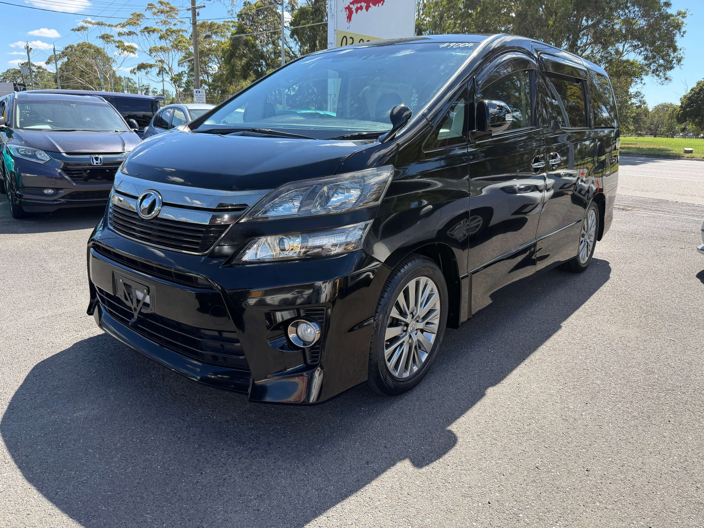 2013 Toyota Vellfire 2.4L Z Golden Eyes Edition in black, 7 seats, front view with stylish design and premium wheels.