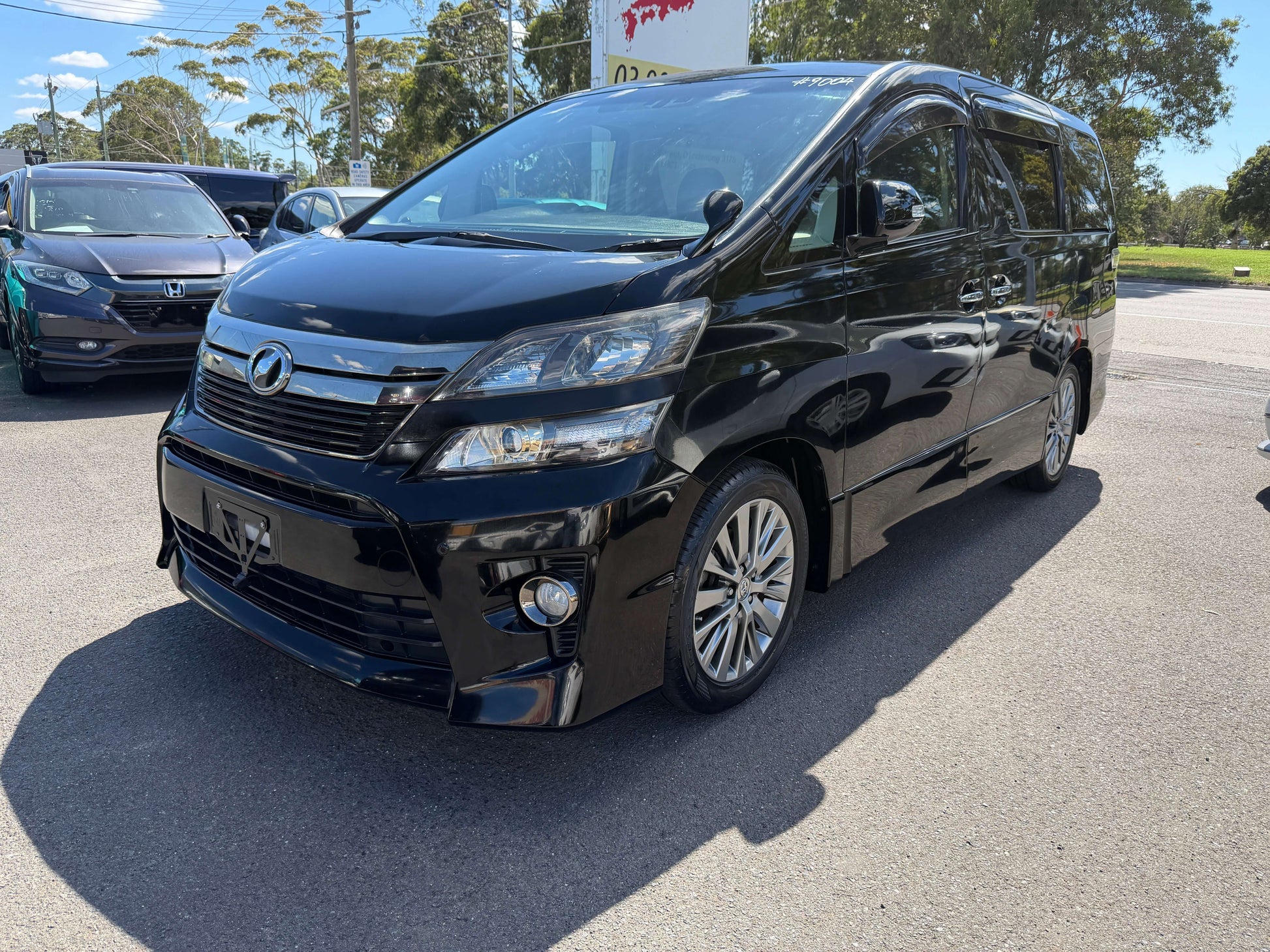 2013 Toyota Vellfire 2.4L Z Golden Eyes Edition in black, 7 seats, front view with stylish design and premium wheels.