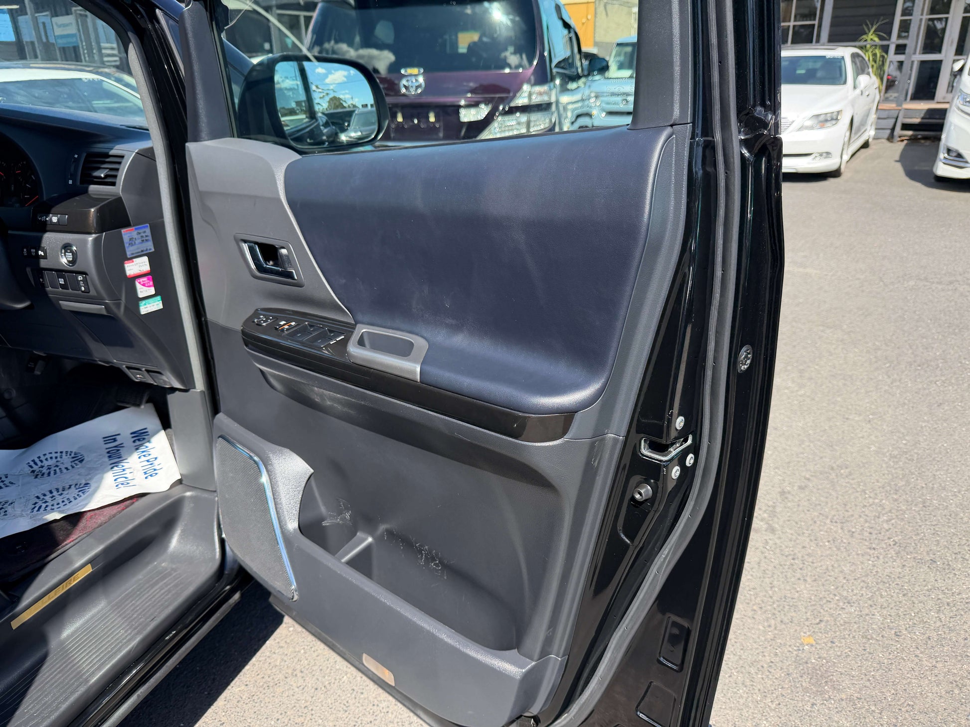 Interior view of 2013 Toyota Vellfire 2.4L Z Golden Eyes Edition door panel showing controls.