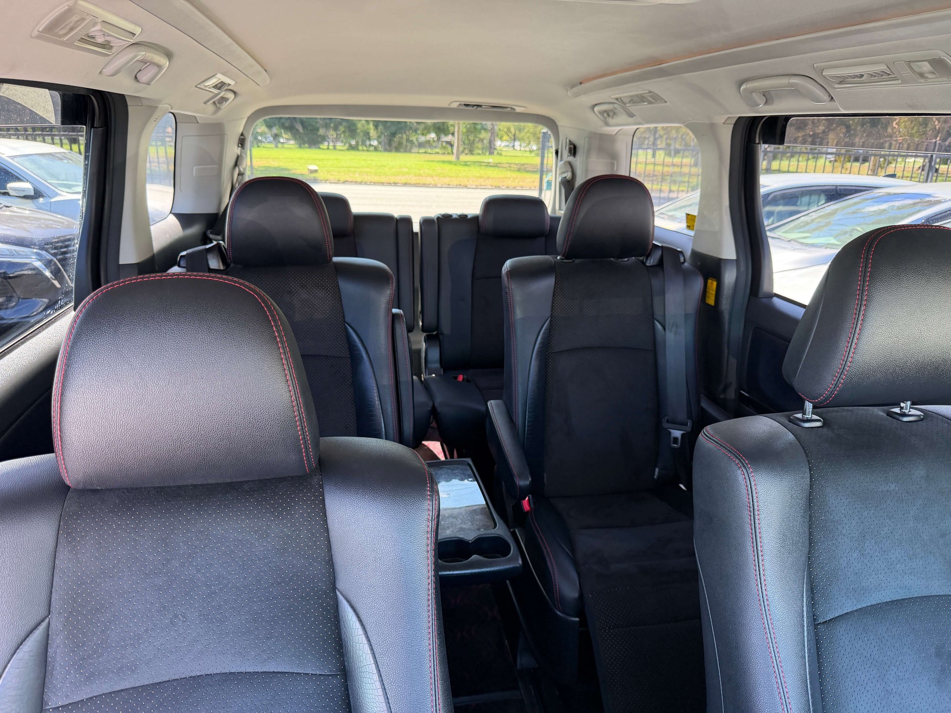 Interior view of 2013 Toyota Vellfire 2.4L Z Golden Eyes Edition showcasing 7 seats arrangement.
